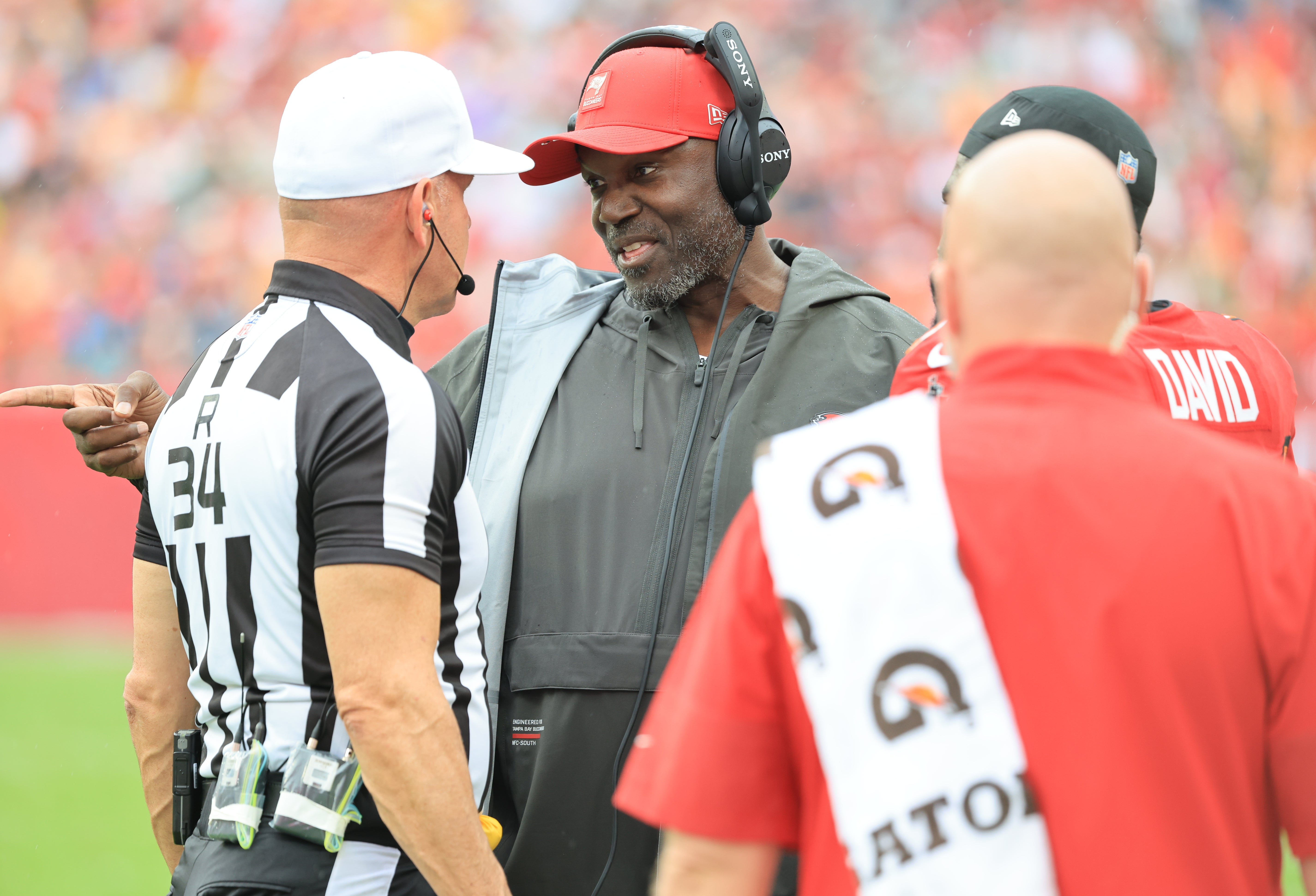 Dec 7, 2025; Tampa, Florida, USA; Tampa Bay Buccaneers head coach Todd Bowles talks with referee Clete Blakeman (34) during the first quarter against the New Orleans Saints at Raymond James Stadium.