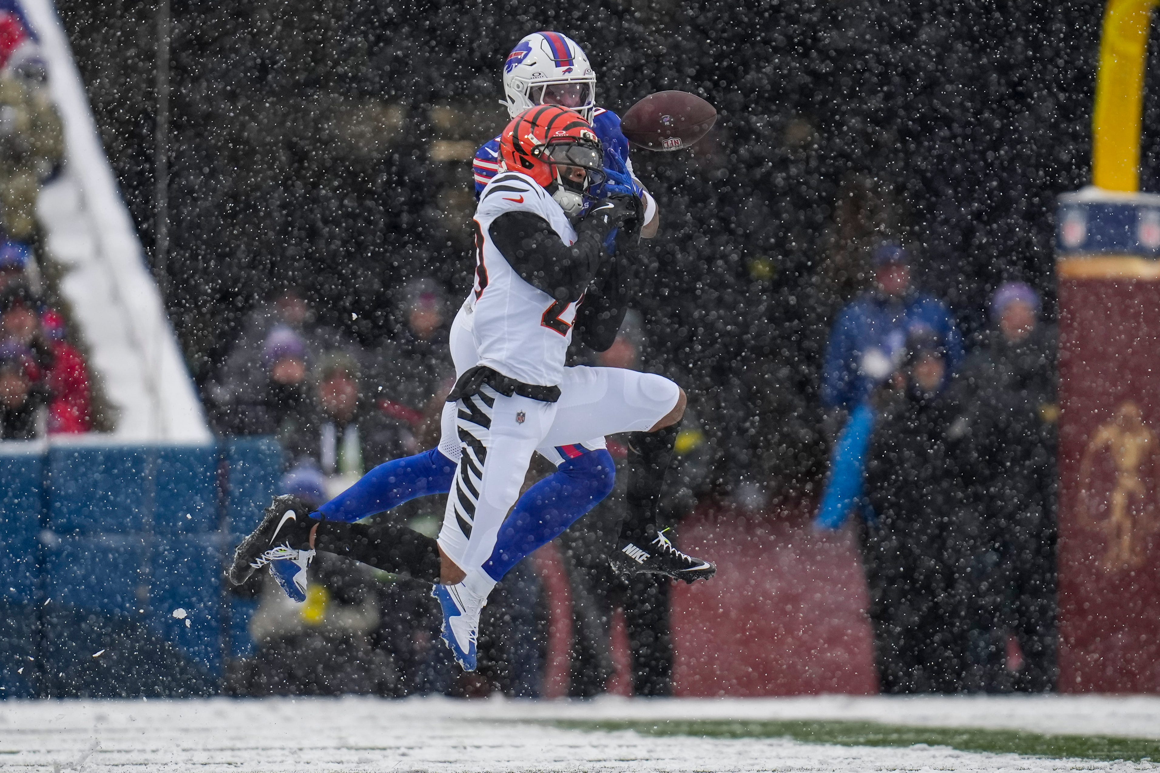 Cincinnati Bengals cornerback DJ Turner II (20) breaks up a pass to Buffalo Bills wife receiver Keon Coleman (0) in the second quarter of the NFL Week 14 game between the Buffalo Bills and the Cincinnati Bengals at Highmark Stadium in Orchard Park, N.Y., on Sunday, Dec. 7, 2025.