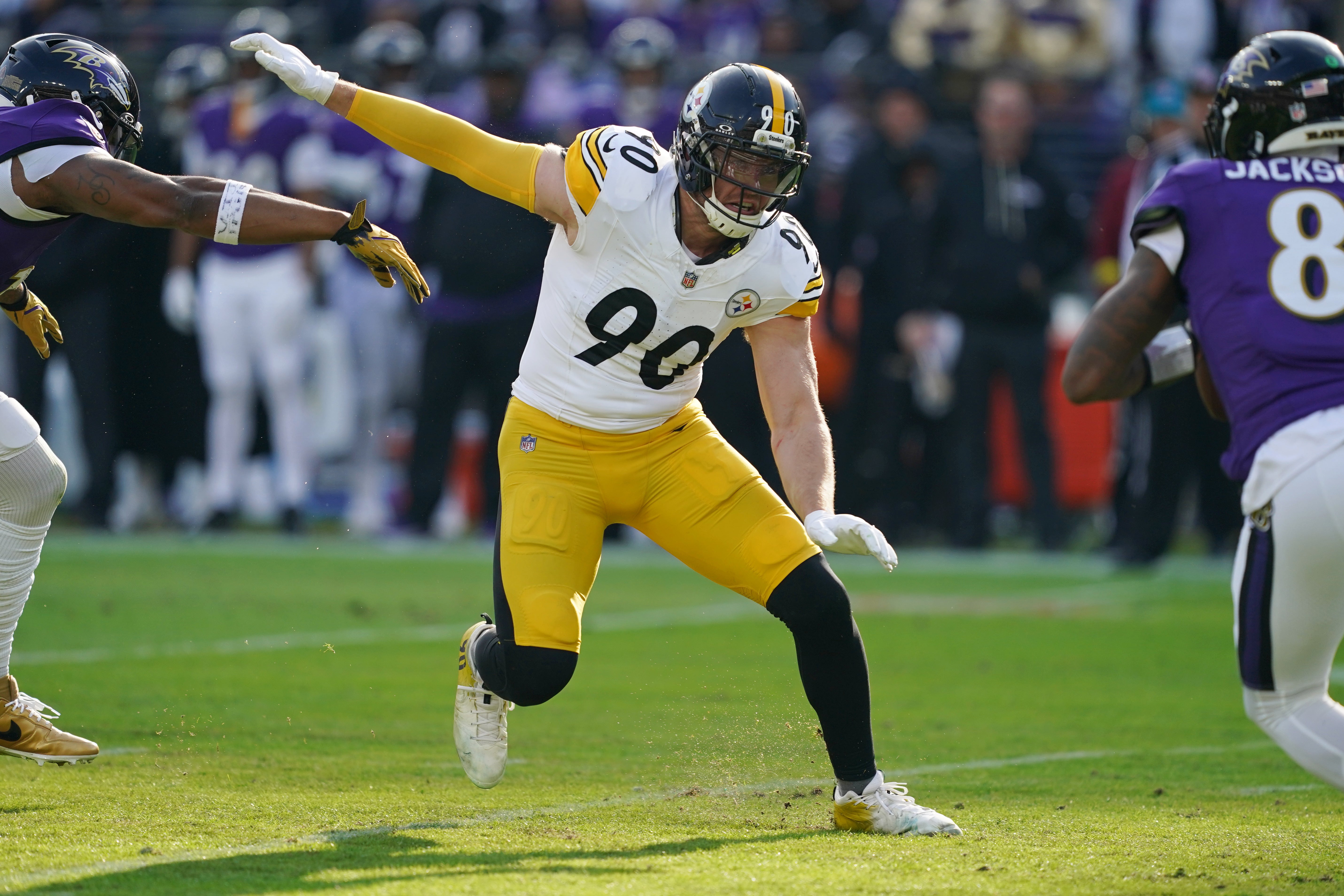Dec 7, 2025; Baltimore, Maryland, USA; Pittsburgh Steelers linebacker T.J. Watt (90) chases down Baltimore Ravens quarterback Lamar Jackson (8) during the first half at M&T Bank Stadium.