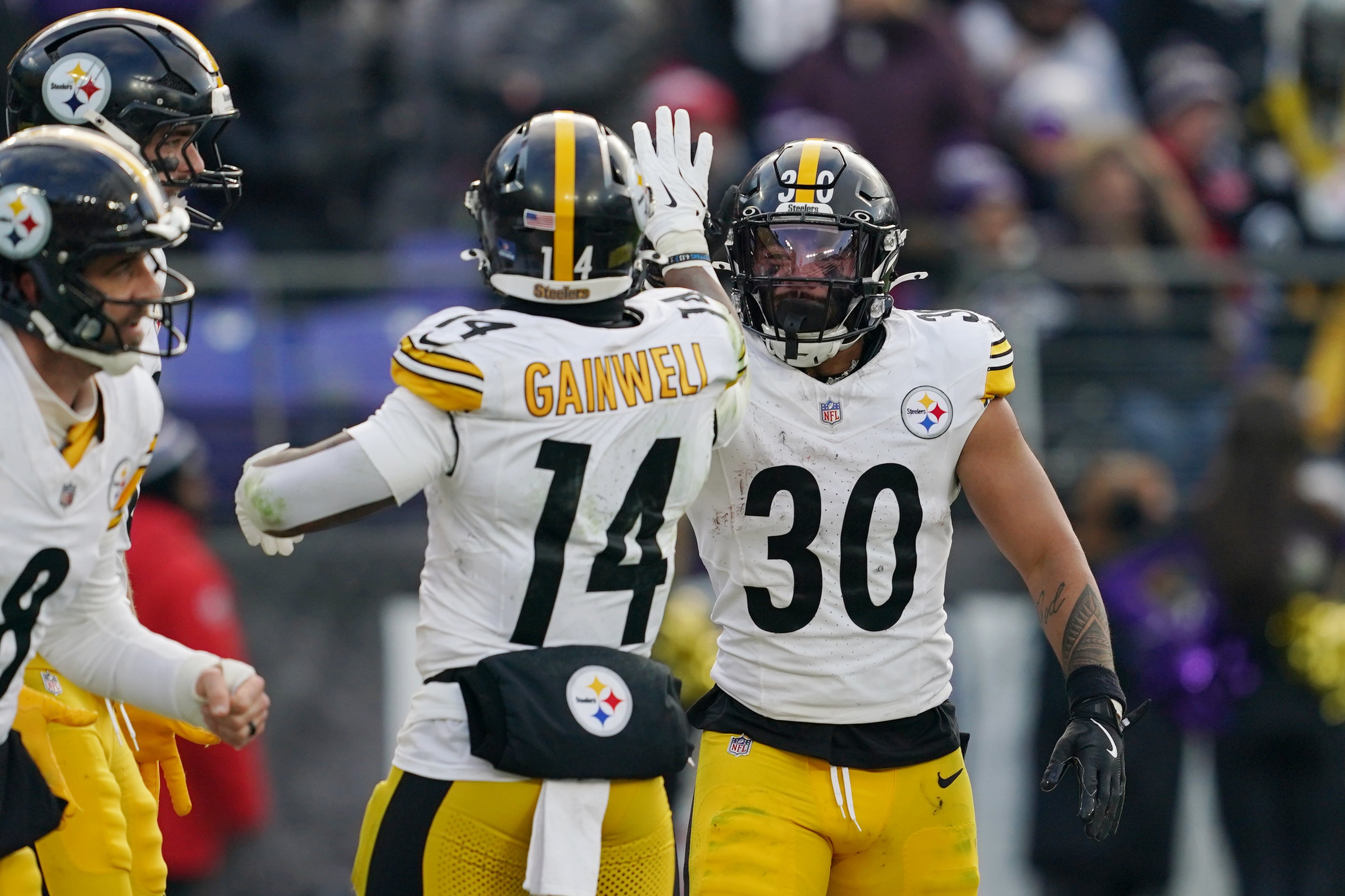 Dec 7, 2025; Baltimore, Maryland, USA; Pittsburgh Steelers running back Jaylen Warren (30) is congratulated by running back Kenneth Gainwell (14) after scoring a touchdown against the Baltimore Ravens during the second half at M&T Bank Stadium