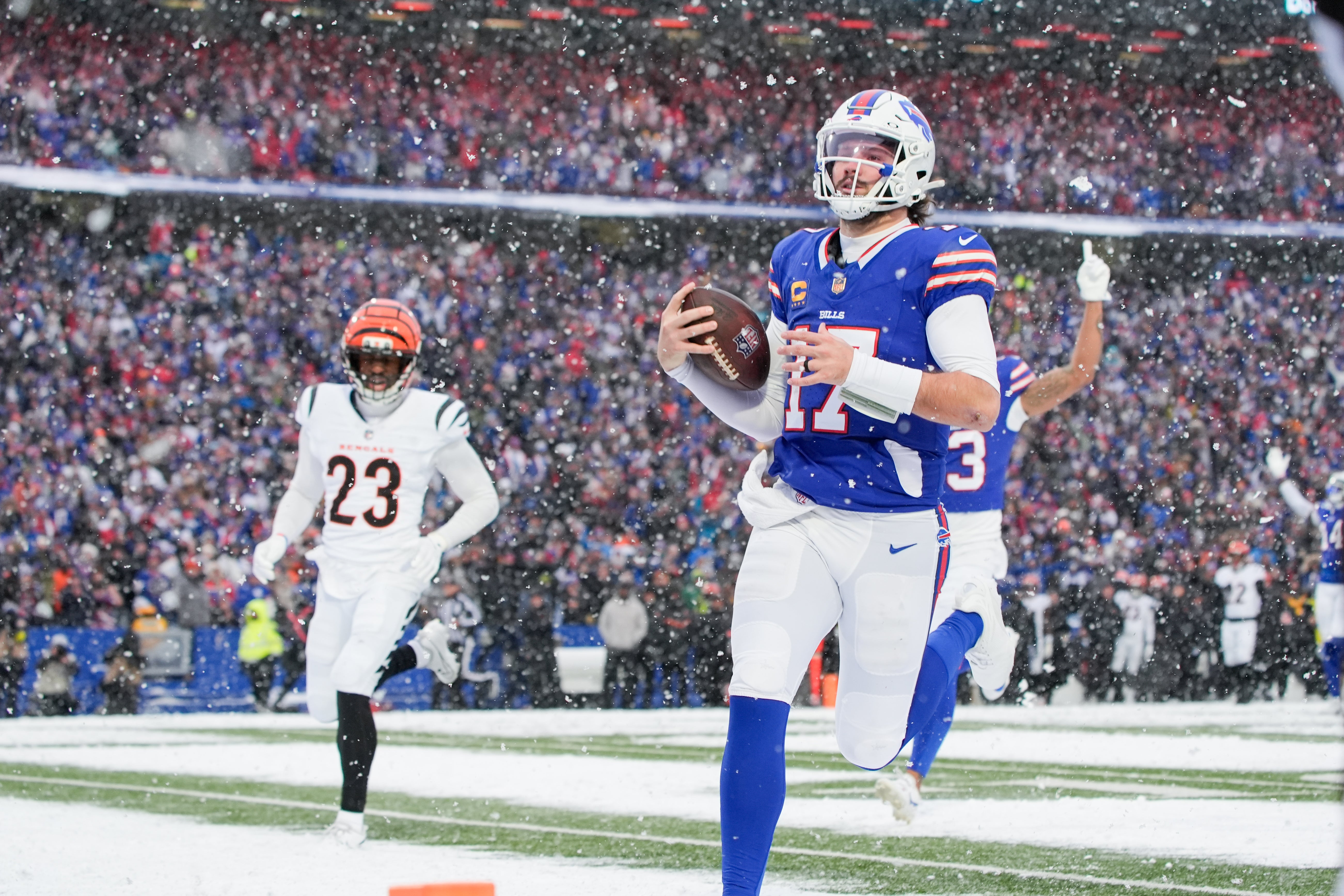Dec 7, 2025; Orchard Park, New York, USA; Buffalo Bills quarterback Josh Allen (17) runs the ball for a touchdown in the fourth quarter against the Cincinnati Bengals at Highmark Stadium.