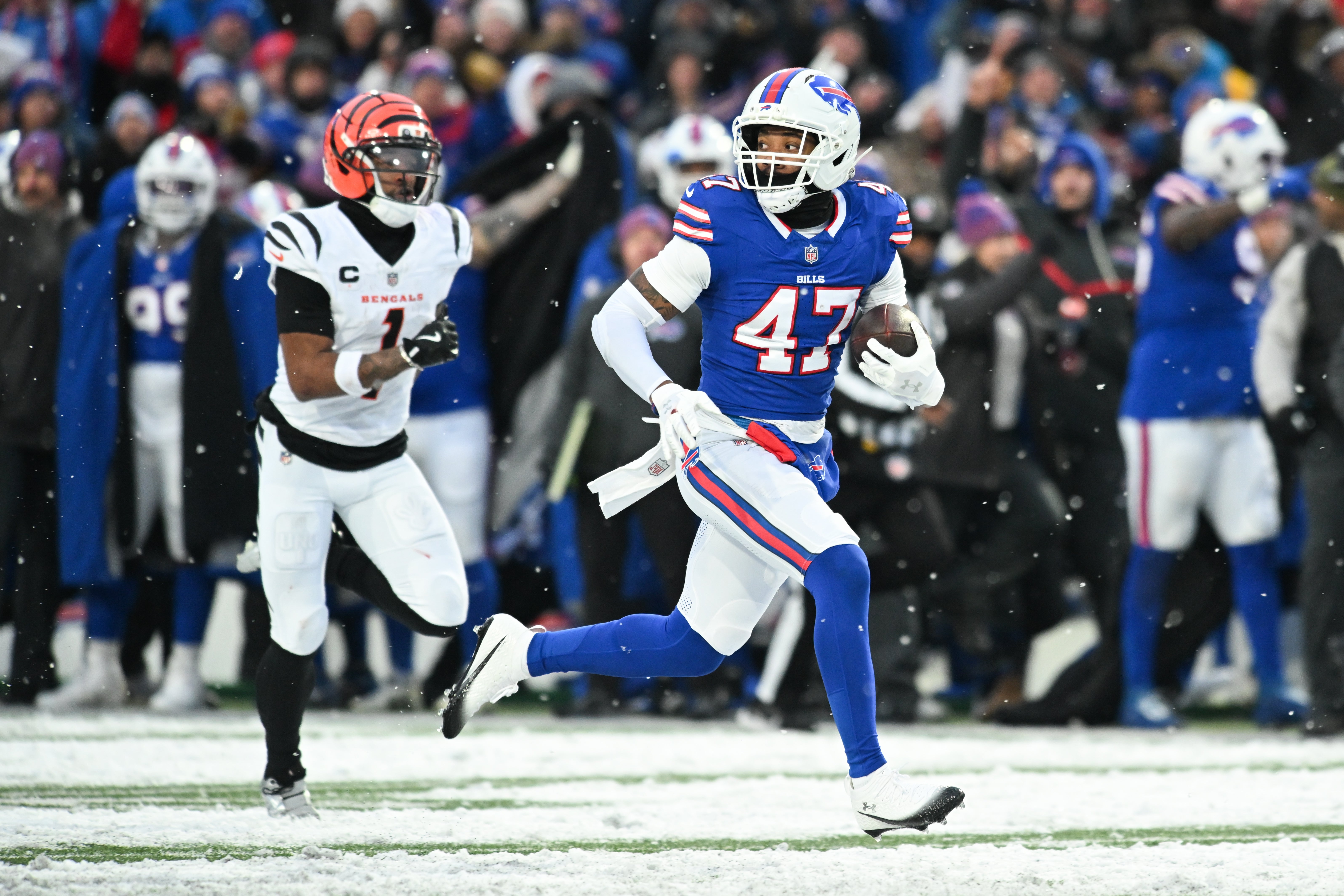 Dec 7, 2025; Orchard Park, New York, USA; Buffalo Bills cornerback Christian Benford (47) runs the ball for a touchdown after an interception against the Cincinnati Bengals in the fourth quarter at Highmark Stadium.