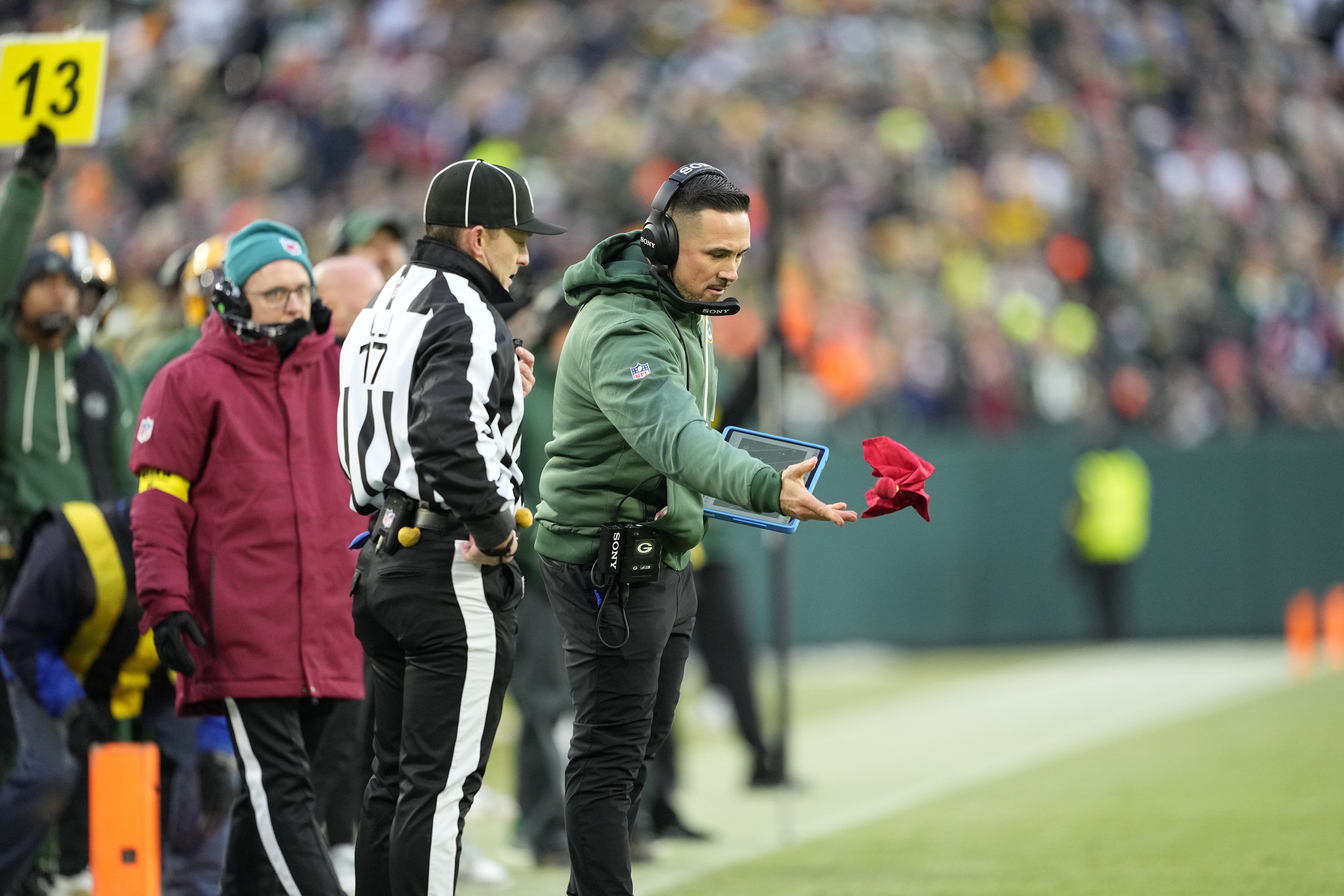Dec 7, 2025; Green Bay, Wisconsin, USA; Green Bay Packers head coach Matt LaFleur challenges a fumble call in the first quarter against the Chicago Bears at Lambeau Field.