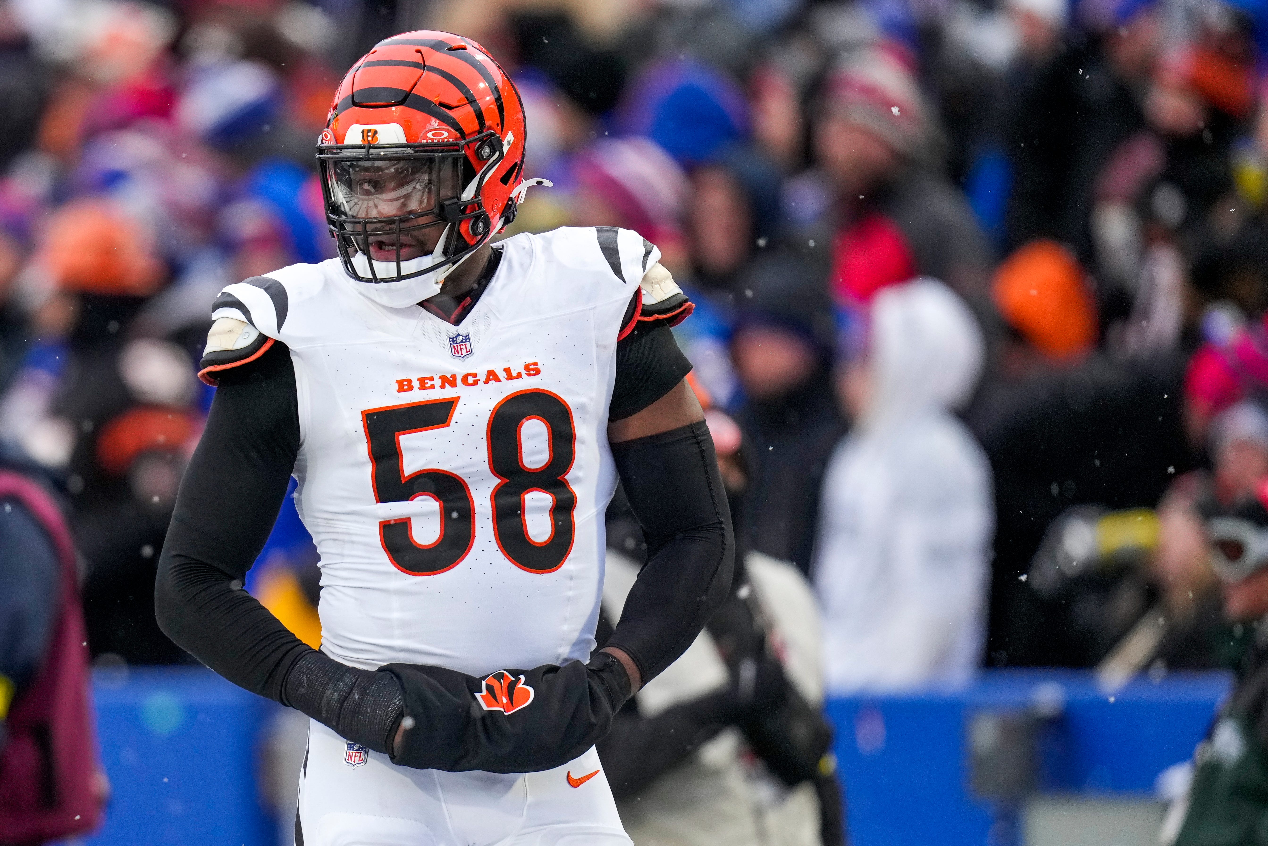 Cincinnati Bengals defensive end Joseph Ossai (58) walks for the locker room with trainers in the fourth quarter of the NFL Week 14 game between the Buffalo Bills and the Cincinnati Bengals at Highmark Stadium in Orchard Park, N.Y., on Sunday, Dec. 7, 2025. The Bills overcame a halftime deficit to win 39-34.