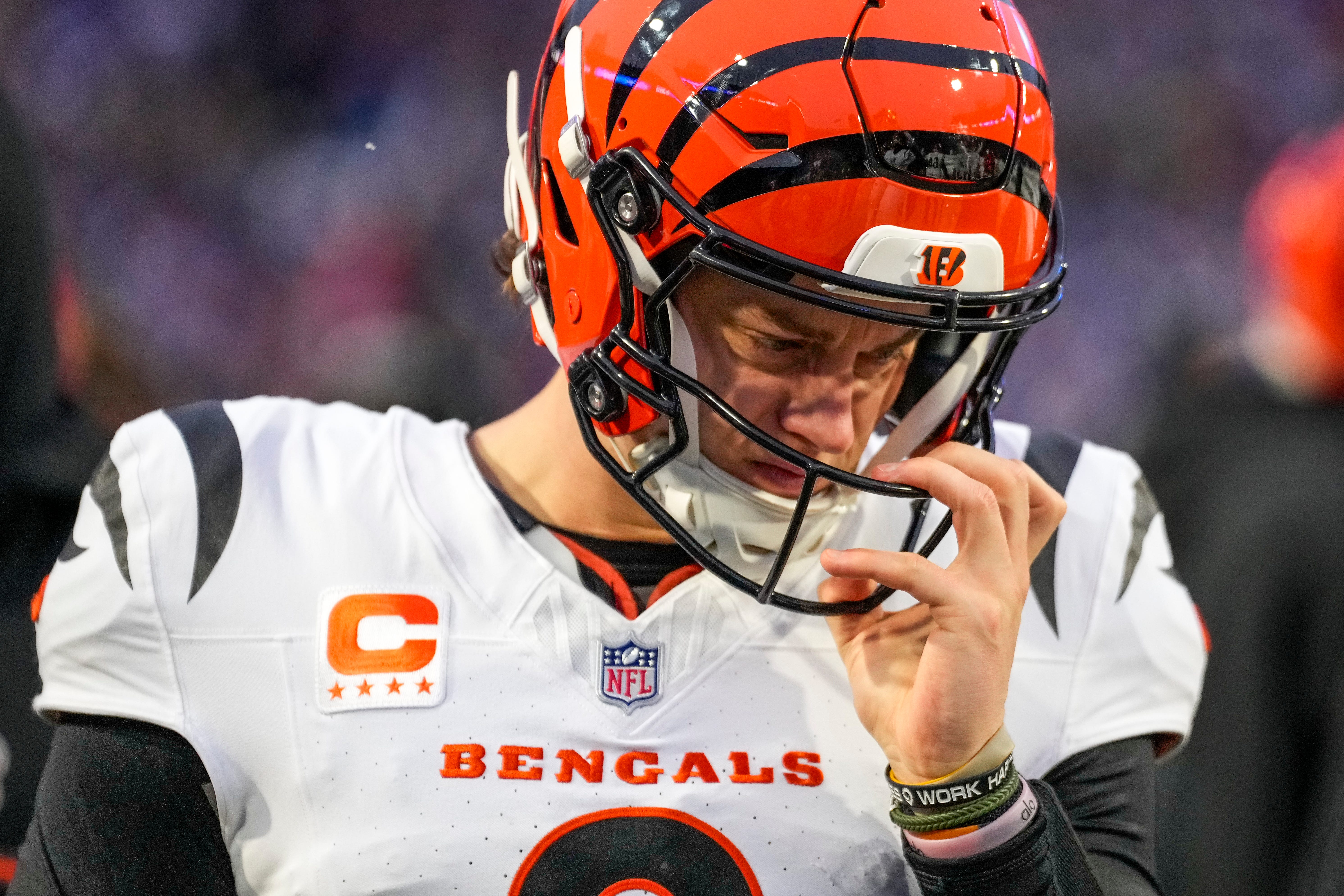 Cincinnati Bengals quarterback Joe Burrow (9) adjusted his helmet on the sideline before taking the field in the fourth quarter of the NFL Week 14 game between the Buffalo Bills and the Cincinnati Bengals at Highmark Stadium in Orchard Park, N.Y., on Sunday, Dec. 7, 2025. The Bills overcame a halftime deficit to win 39-34.
