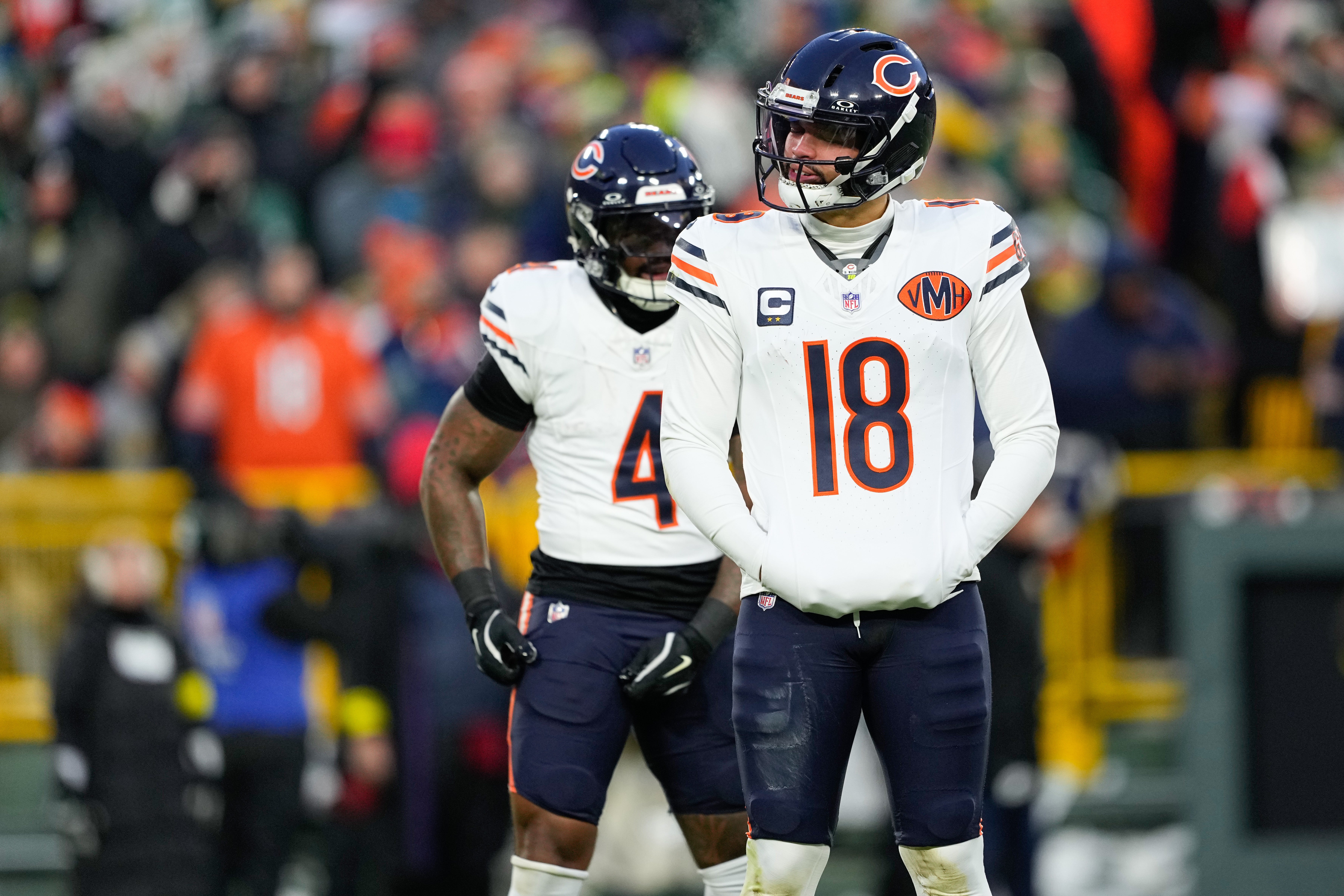 Dec 7, 2025; Green Bay, Wisconsin, USA; Chicago Bears quarterback Caleb Williams (18) reacts in the first quarter against the Green Bay Packers at Lambeau Field.