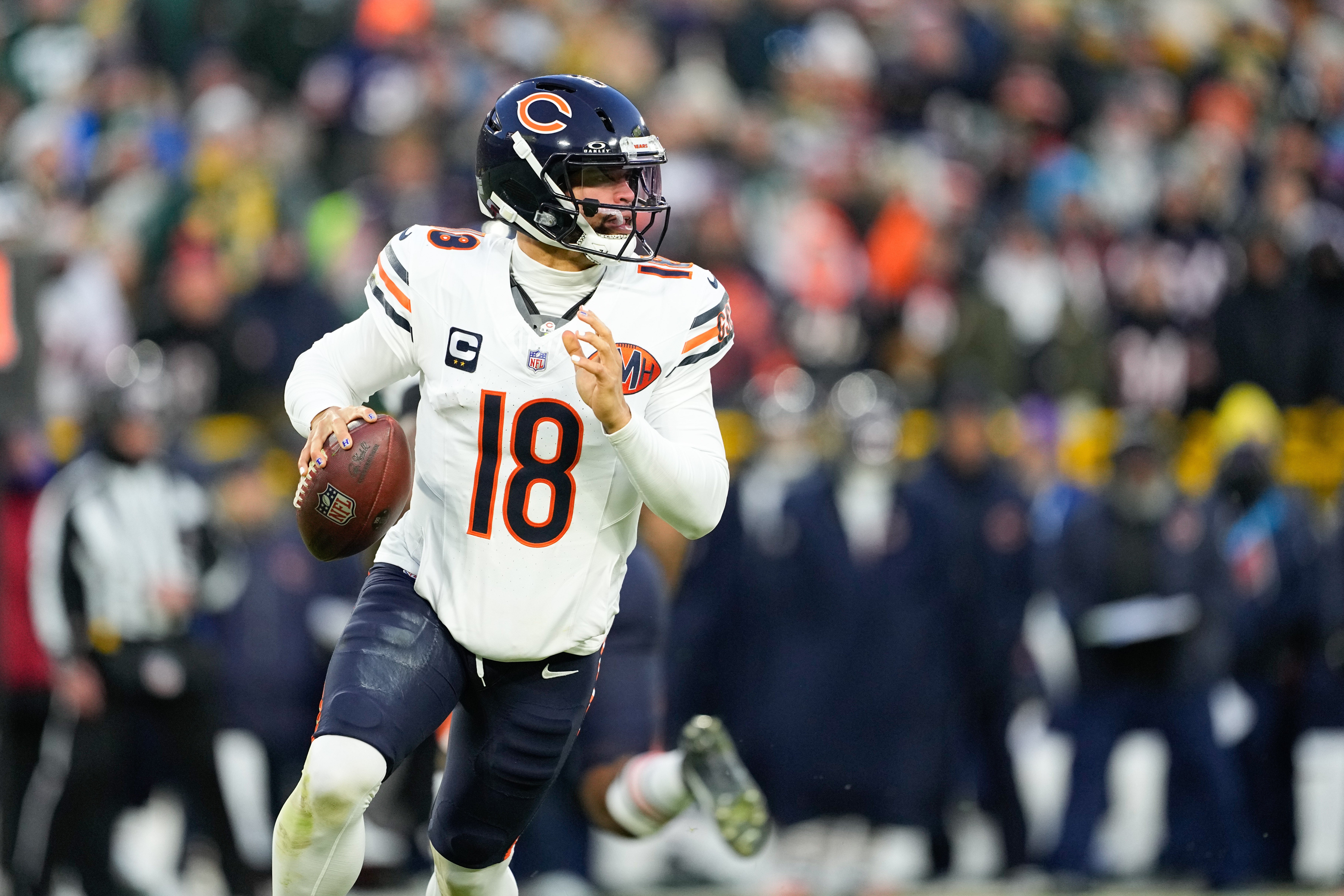 Dec 7, 2025; Green Bay, Wisconsin, USA; Chicago Bears quarterback Caleb Williams (18) looks to throw in the first quarter against the Green Bay Packers at Lambeau Field.