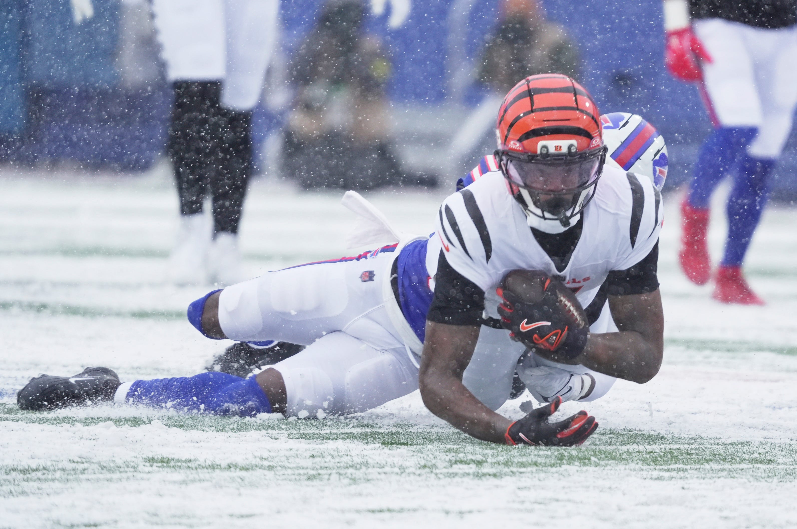 Cincinnati Bengals wide receiver Tee Higgins gets taken down by Buffalo Bills cornerback Tre'Davious White during first half action at Highmark Stadium in Orchard Park on Dec. 7, 2025.