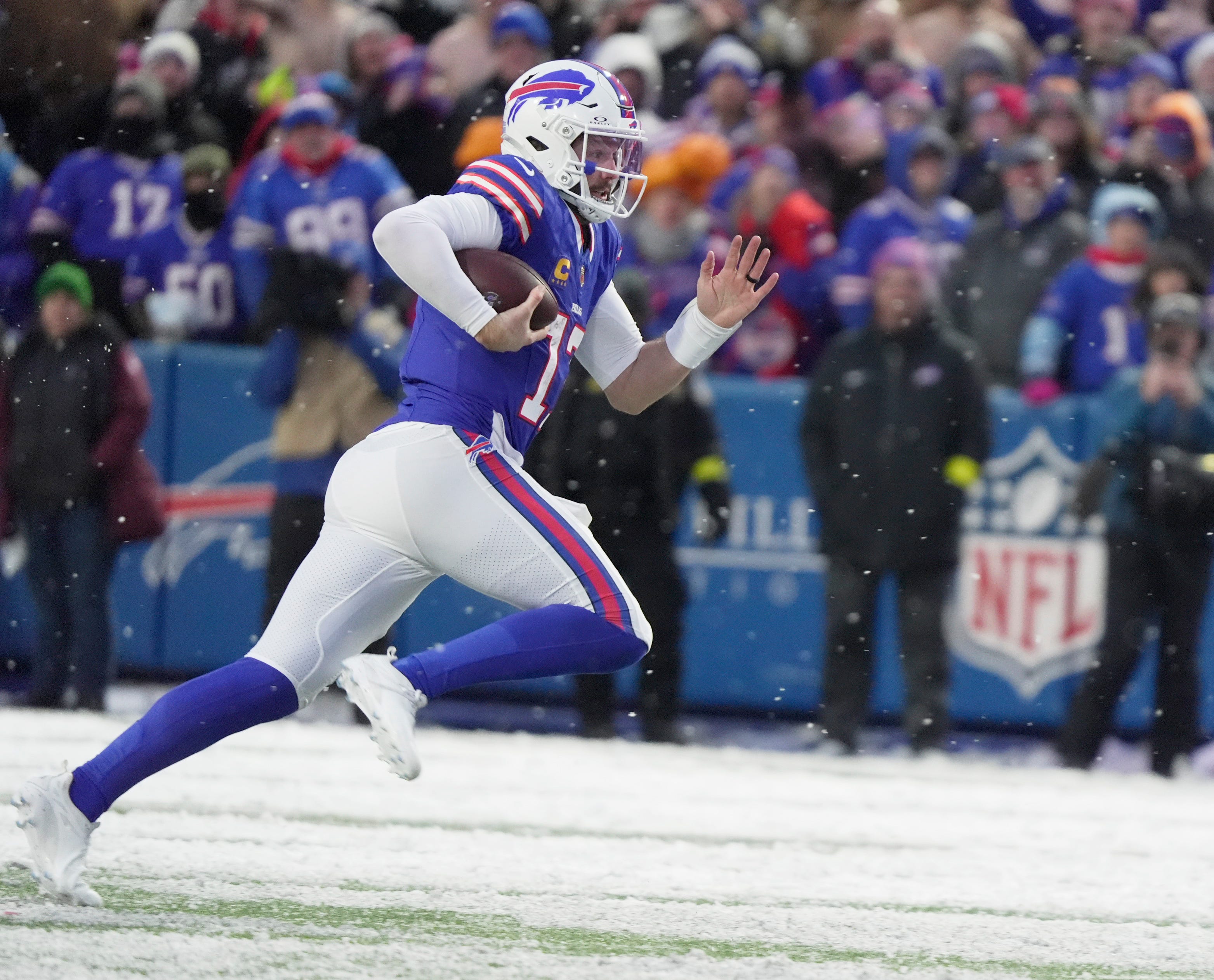 Buffalo Bills quarterback Josh Allen sprints ahead of everyone and runs for a first down during the fourth quarter at Highmark Stadium in Orchard Park on Dec. 7, 2025.