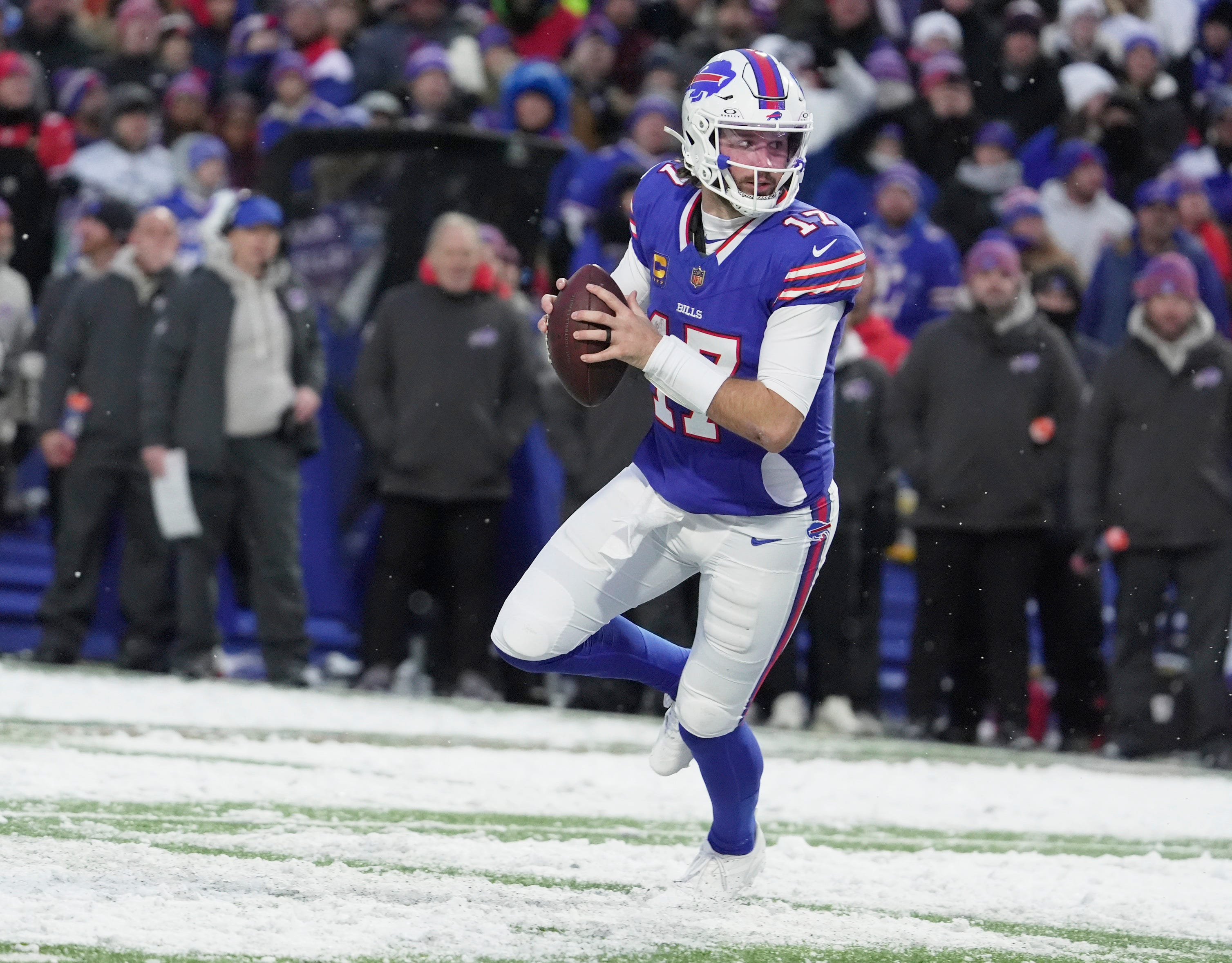 Buffalo Bills quarterback Josh Allen runs with the ball looking to throw to a receiver during second half action at Highmark Stadium in Orchard Park on Dec. 7, 2025.