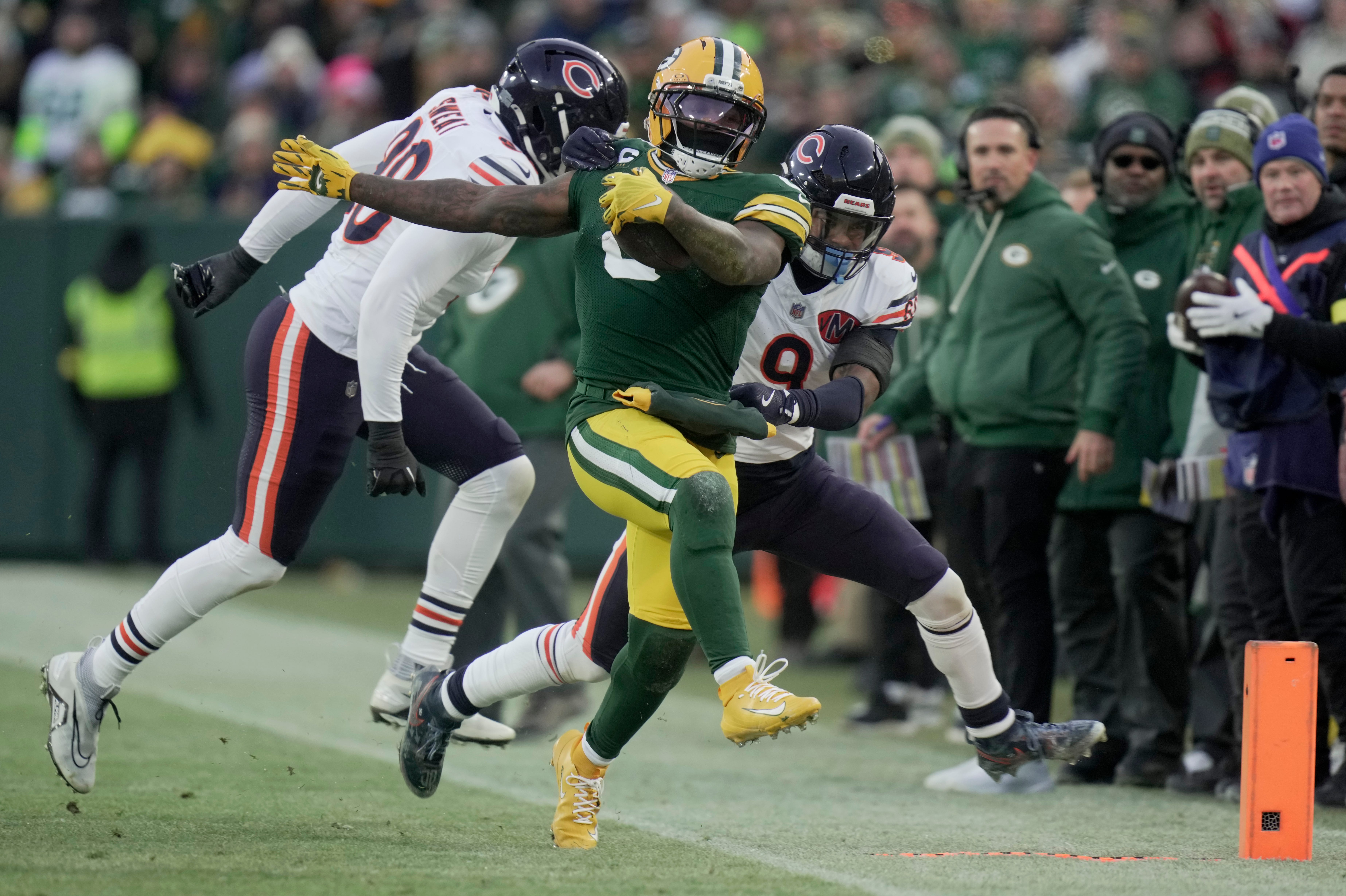 Green Bay Packers running back Josh Jacobs (8) runs for a first down during the first quarter of their game against the Chicago Bears Sunday, December 7, 2025 at Lambeau Field in Green Bay, Wisconsin.