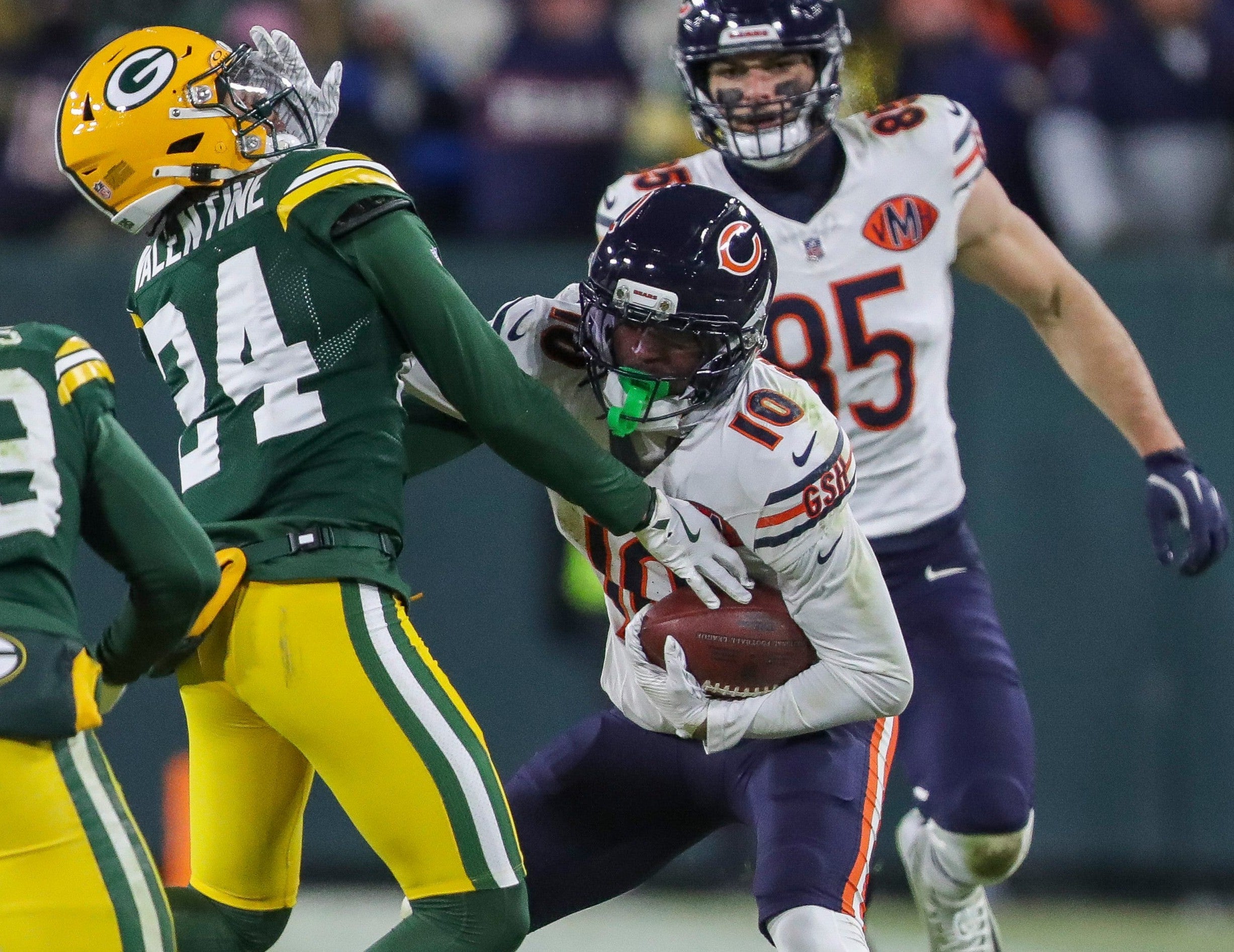 Chicago Bears wide receiver Luther Burden III (10) stiff-arms Green Bay Packers cornerback Carrington Valentine (24) on Sunday, December 7, 2025, at Lambeau Field in Green Bay, Wis.