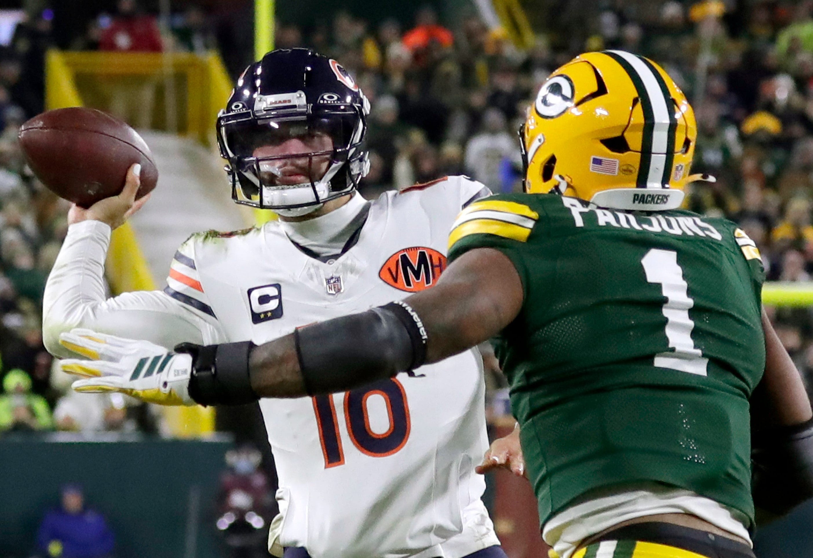 Green Bay Packers defensive end Micah Parsons (1) pressures Chicago Bears quarterback Caleb Williams (18) on Sunday, December 7, 2025, at Lambeau Field in Green Bay, Wis.