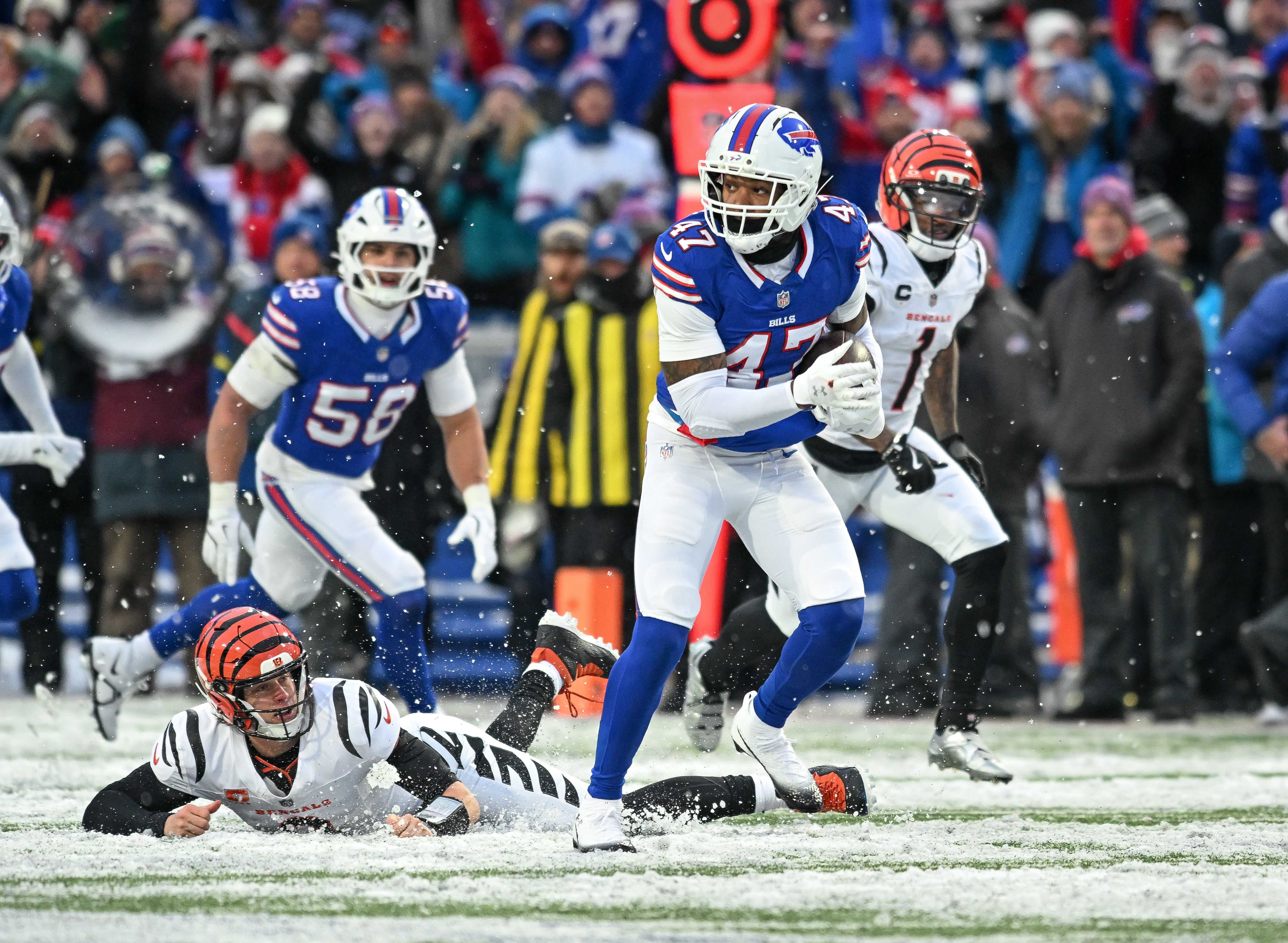 Dec 7, 2025; Orchard Park, New York, USA; Buffalo Bills cornerback Christian Benford (47) returns an interception of Buffalo Bills safety Taylor Rapp (on the ground) for a touchdown in the fourth quarter at Highmark Stadium.