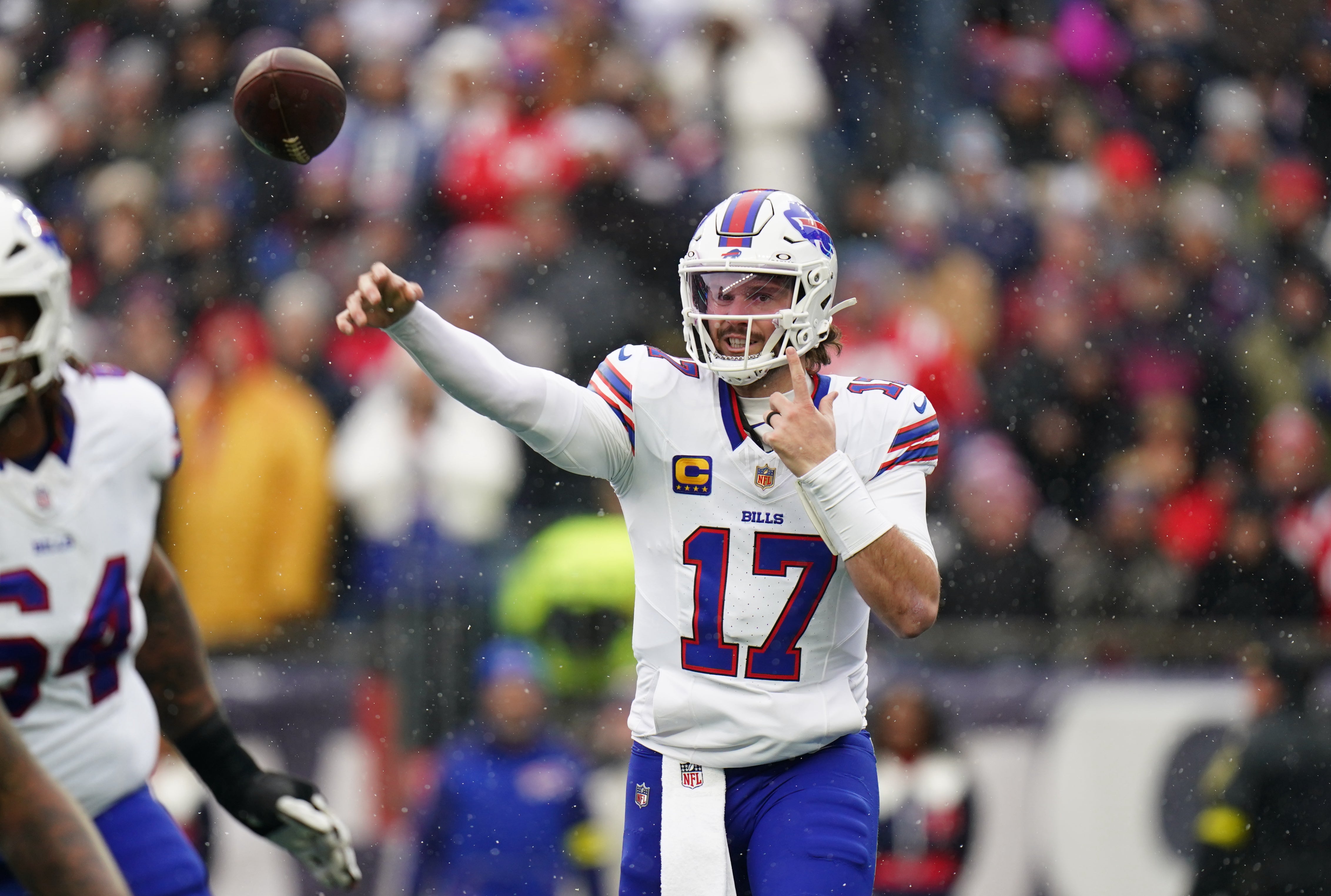 Dec 14, 2025; Foxborough, Massachusetts, USA; Buffalo Bills quarterback Josh Allen (17) passes the ball against the New England Patriots in the first quarter at Gillette Stadium.