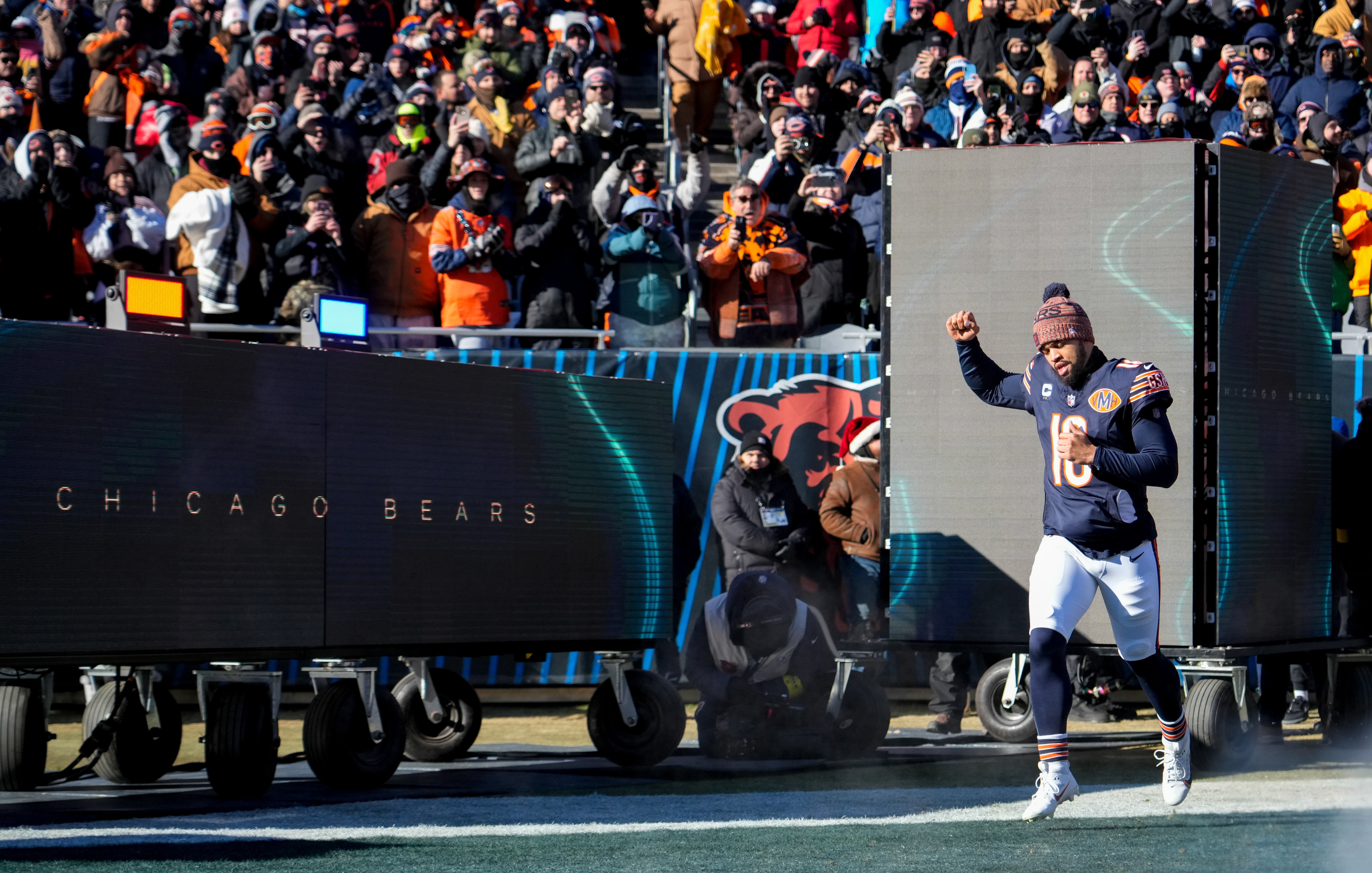 Dec 14, 2025; Chicago, Illinois, USA; Chicago Bears quarterback Caleb Williams (18) runs onto the field prior to the game against the Cleveland Browns at Soldier Field.