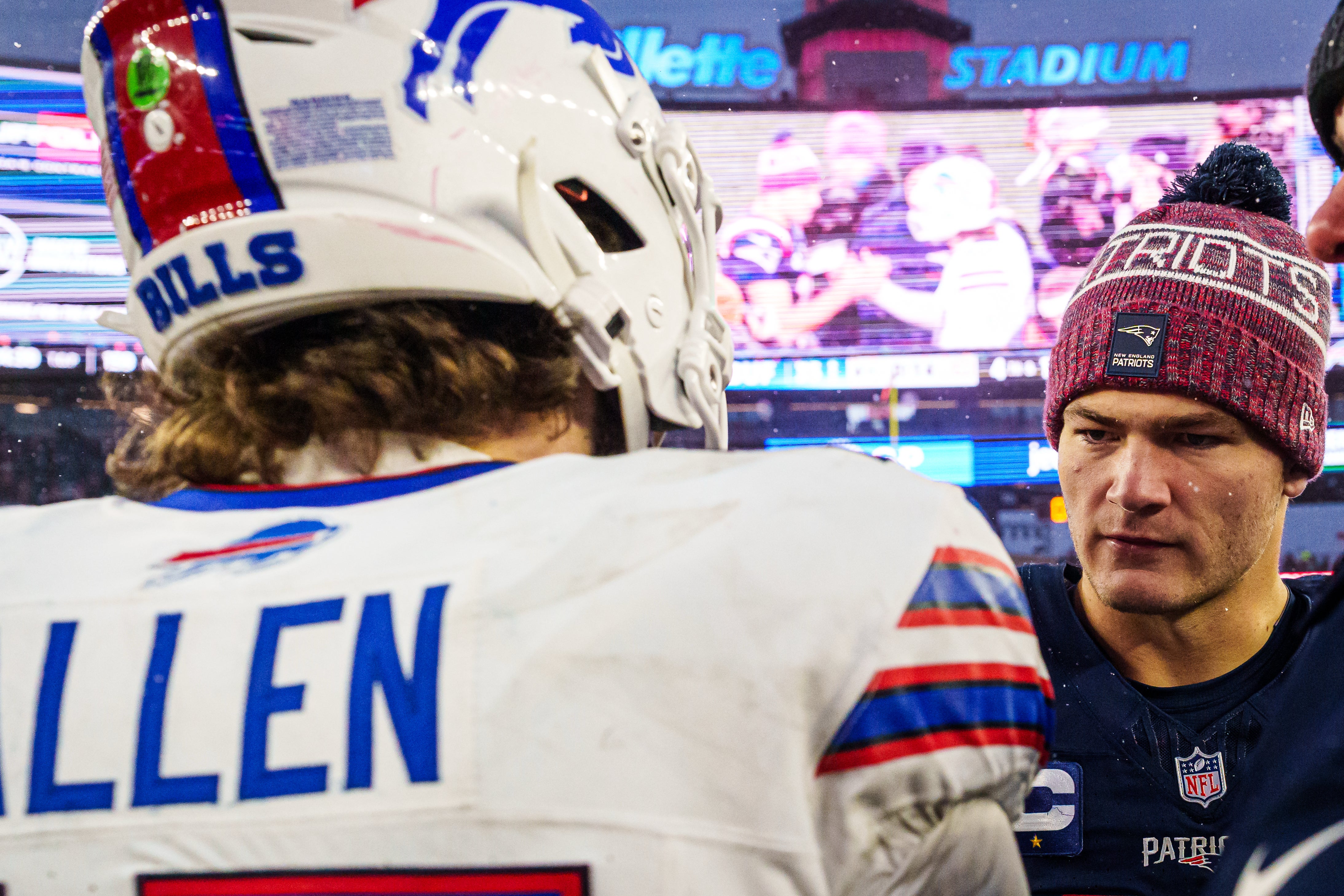 Dec 14, 2025; Foxborough, Massachusetts, USA; New England Patriots quarterback Drake Maye (10) meets Buffalo Bills quarterback Josh Allen (17) on the field after the game at Gillette Stadium.