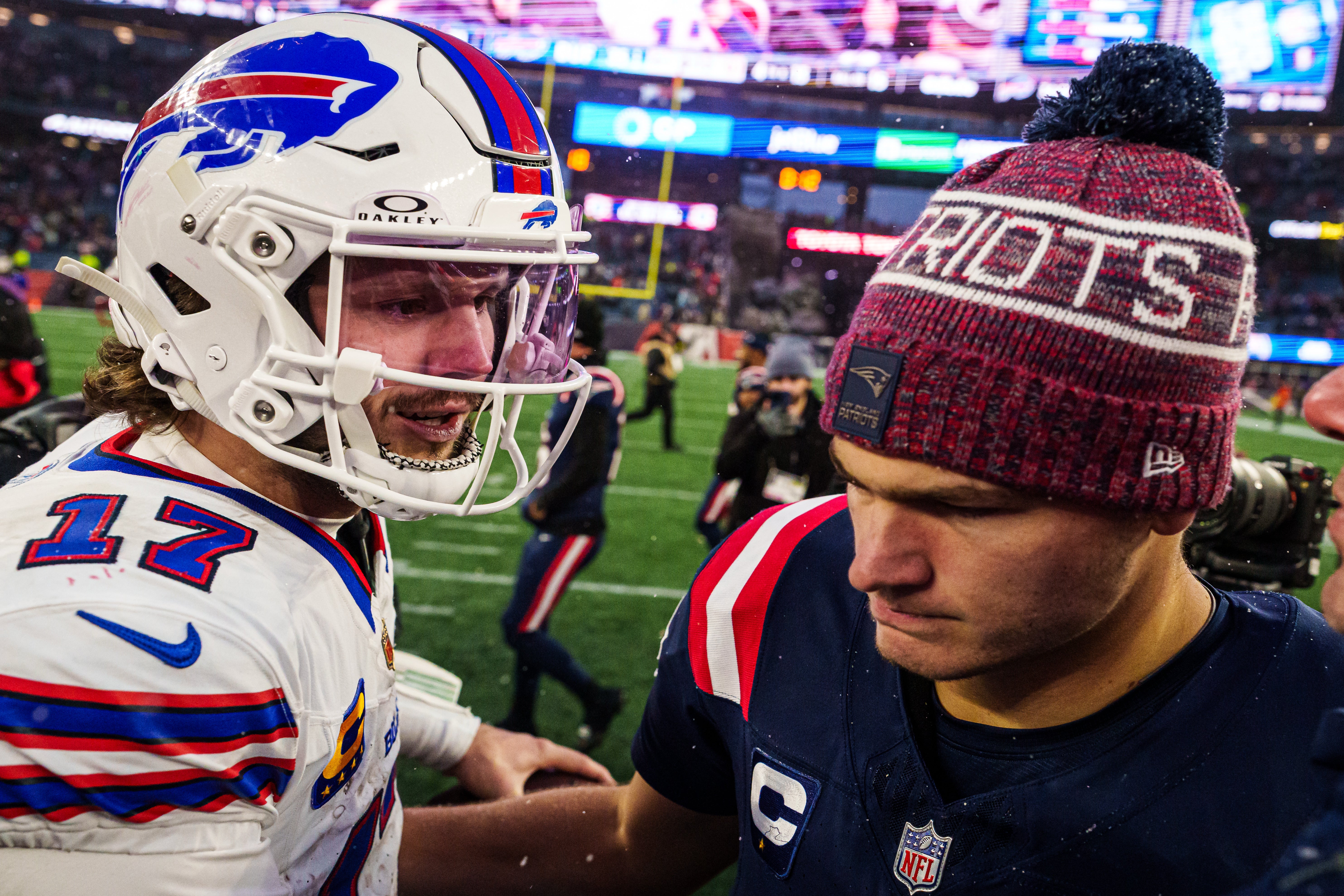 Dec 14, 2025; Foxborough, Massachusetts, USA; New England Patriots quarterback Drake Maye (10) meets Buffalo Bills quarterback Josh Allen (17) on the field after the game at Gillette Stadium.