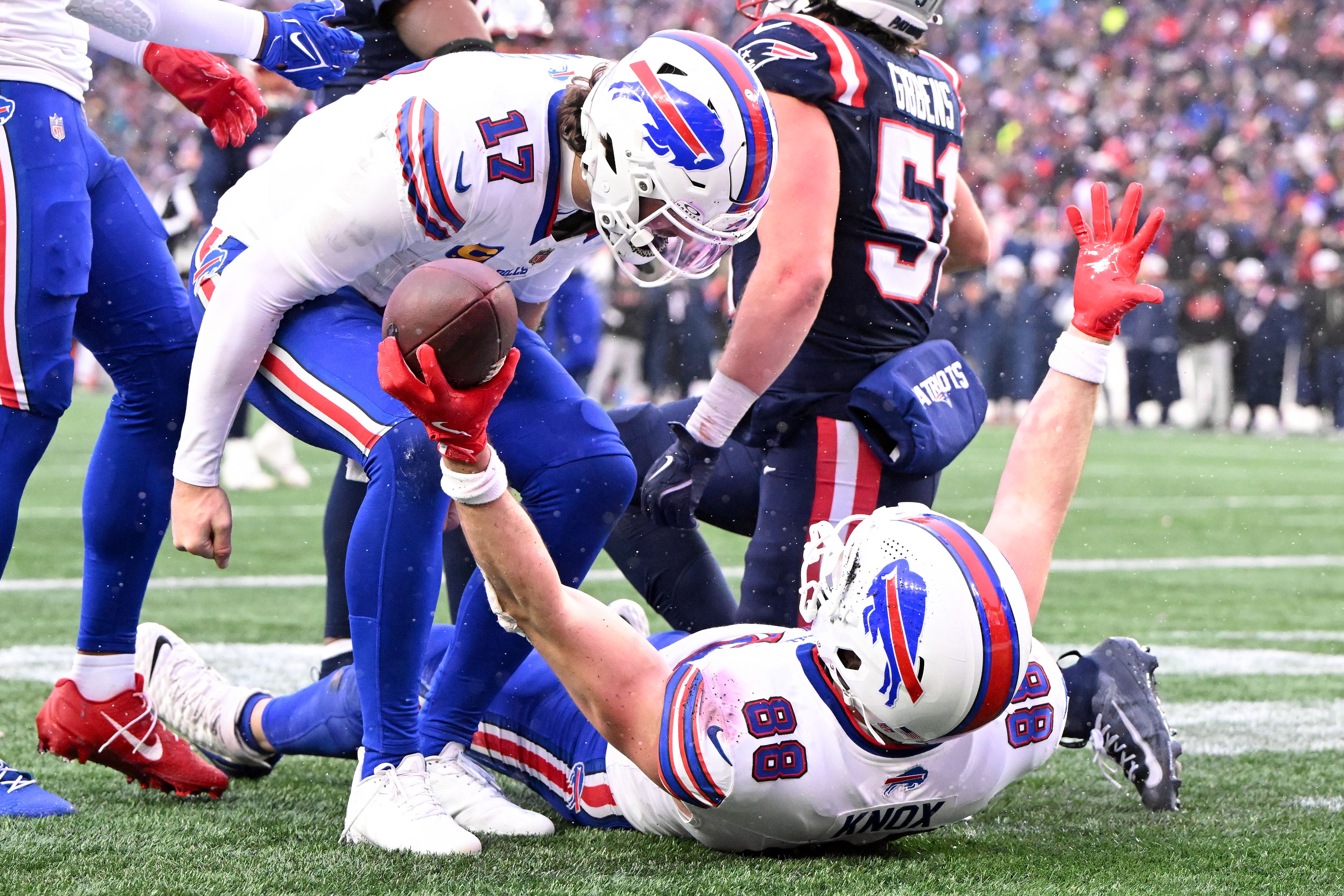 Dec 14, 2025; Foxborough, Massachusetts, USA; Buffalo Bills tight end Dawson Knox (88) celebrates with quarterback Josh Allen (17) after scoring a touchdown against the New England Patriots during the second half at Gillette Stadium.