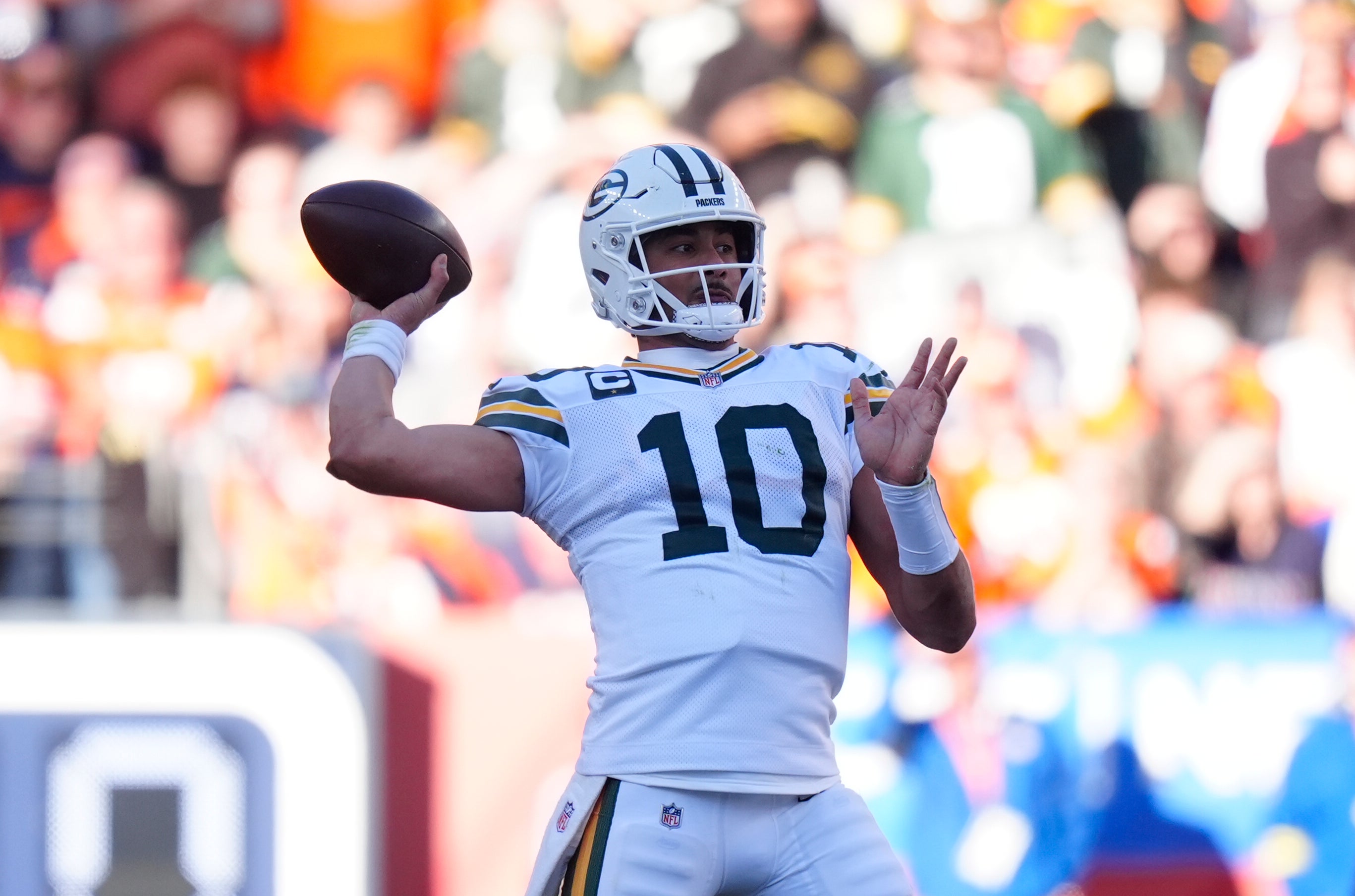 Dec 14, 2025; Denver, Colorado, USA; Green Bay Packers quarterback Jordan Love (10) throws downfield during the first quarter against the Denver Broncos at Empower Field at Mile High.