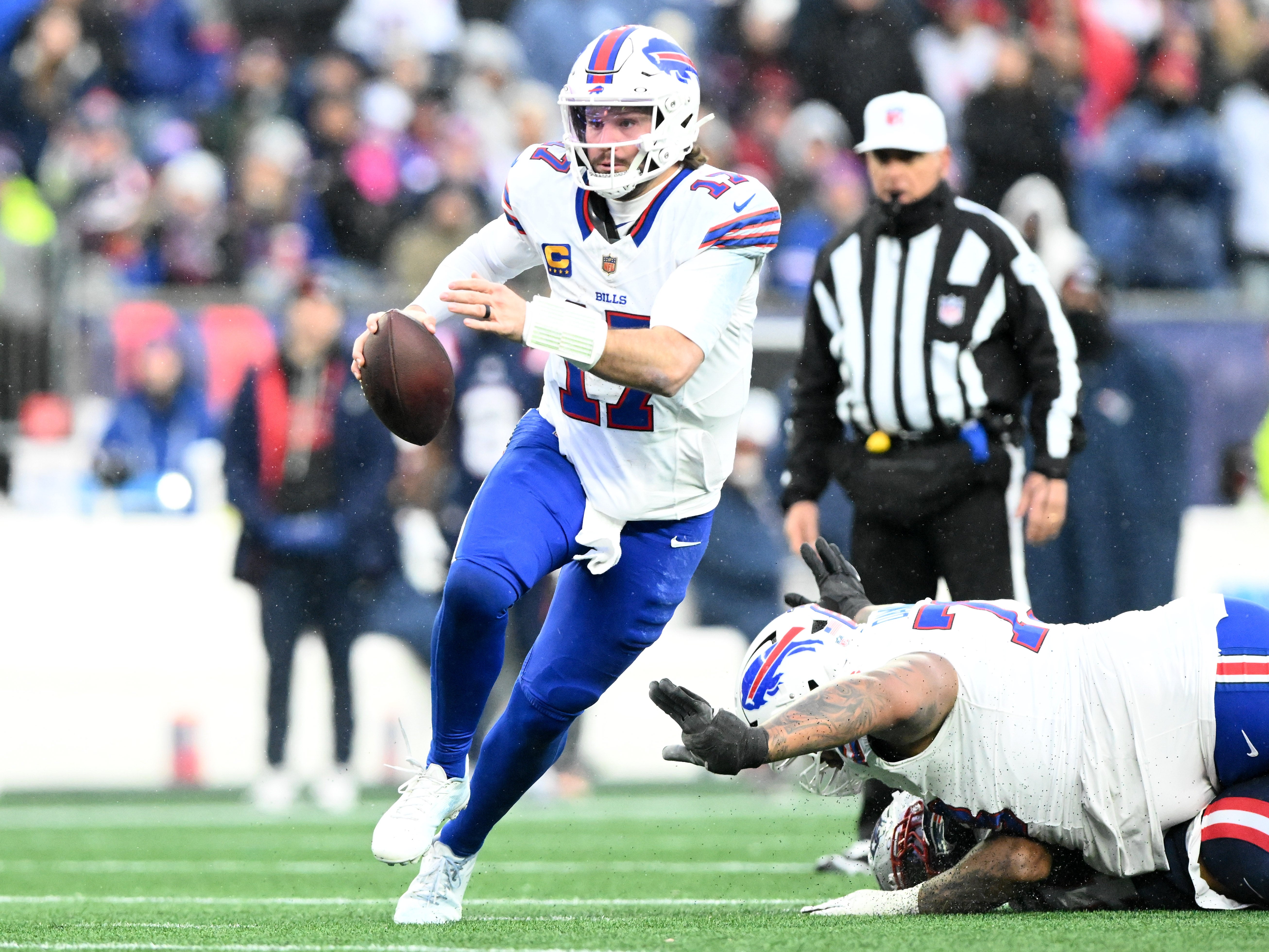 Dec 14, 2025; Foxborough, Massachusetts, USA; Buffalo Bills quarterback Josh Allen (17) runs against the New England Patriots during the second half at Gillette Stadium.