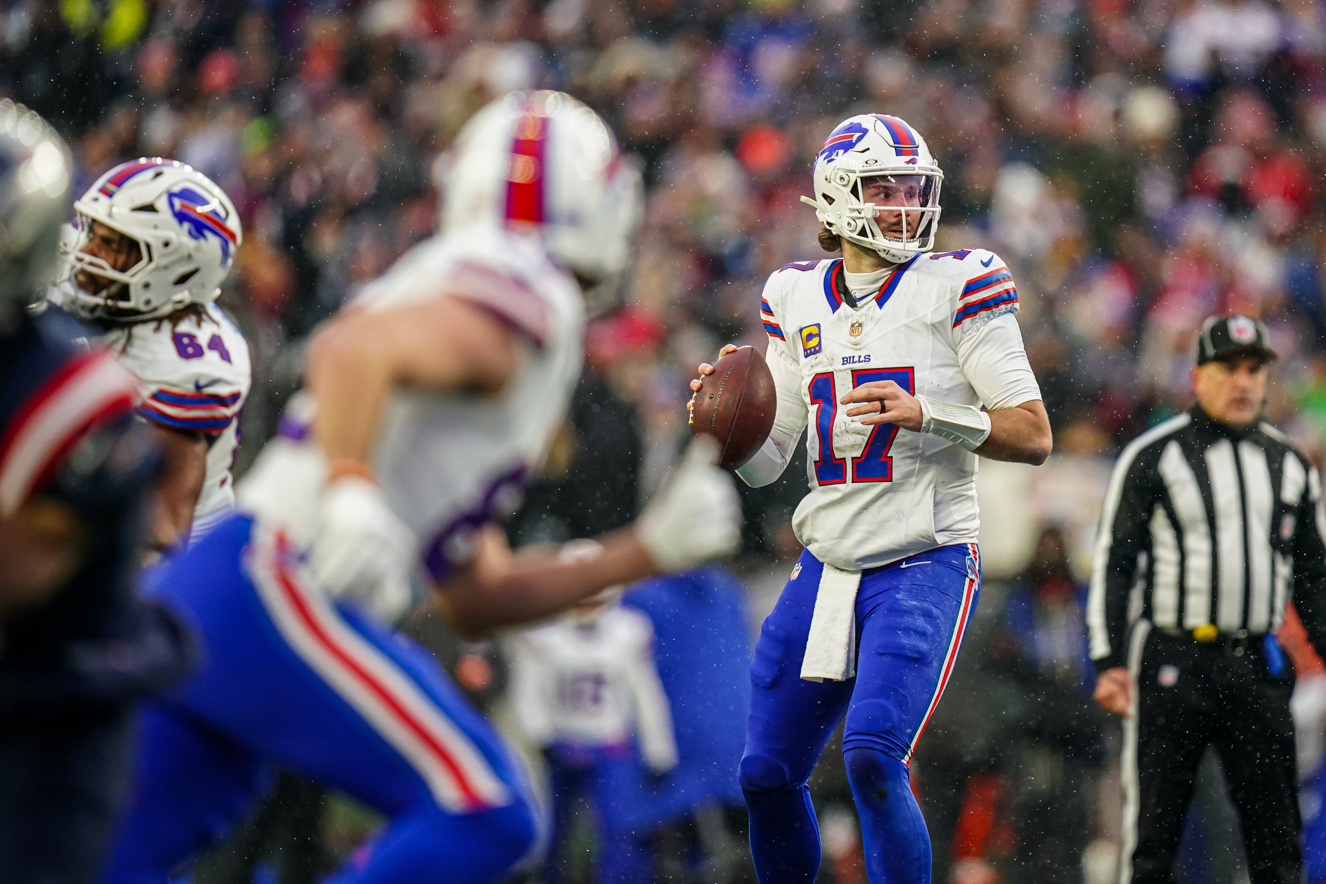 Dec 14, 2025; Foxborough, Massachusetts, USA; Buffalo Bills quarterback Josh Allen (17) looks to pass the ball against the New England Patriots in the second half at Gillette Stadium.