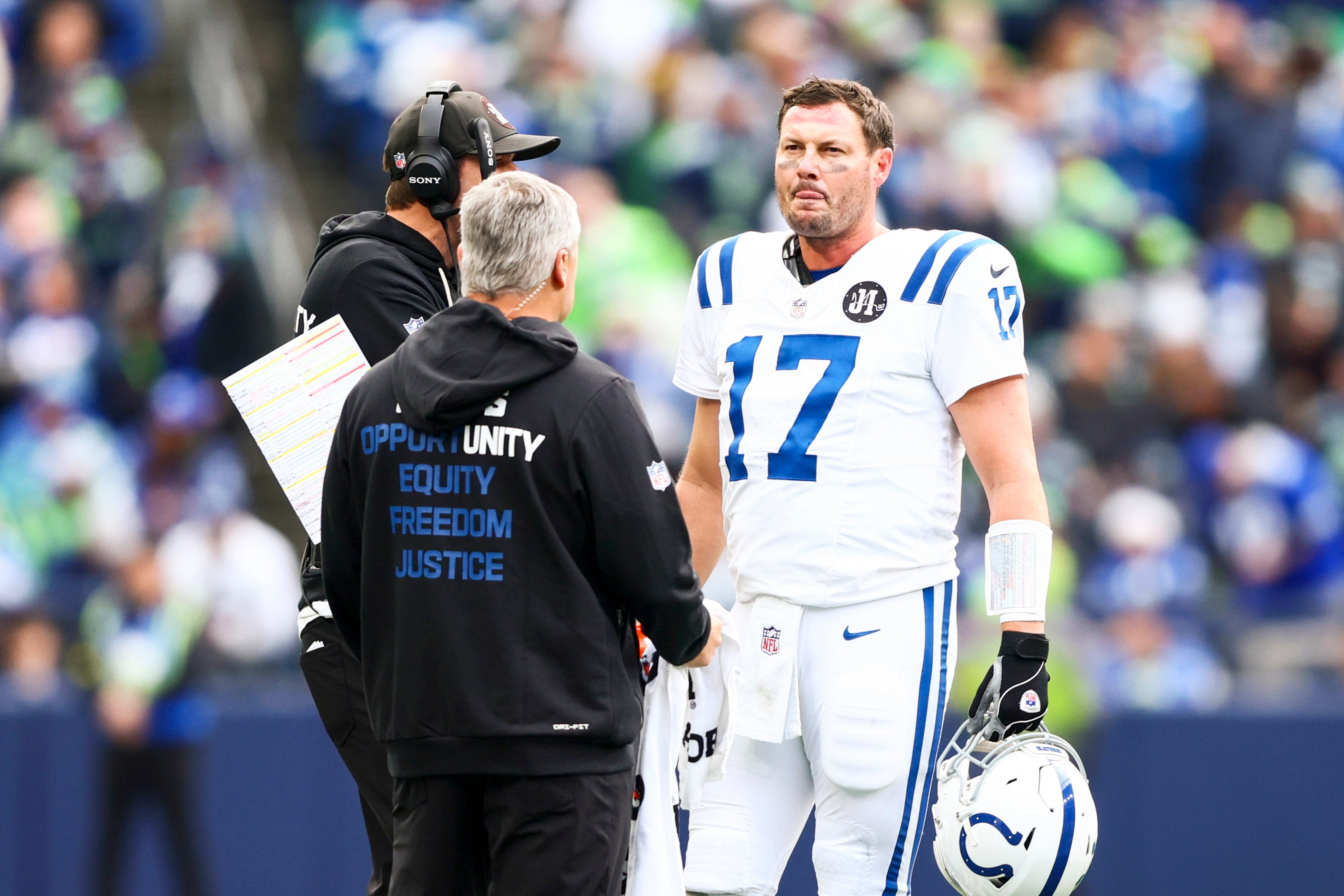 Colts QB Philip Rivers speaking with head coach Shane Steichen