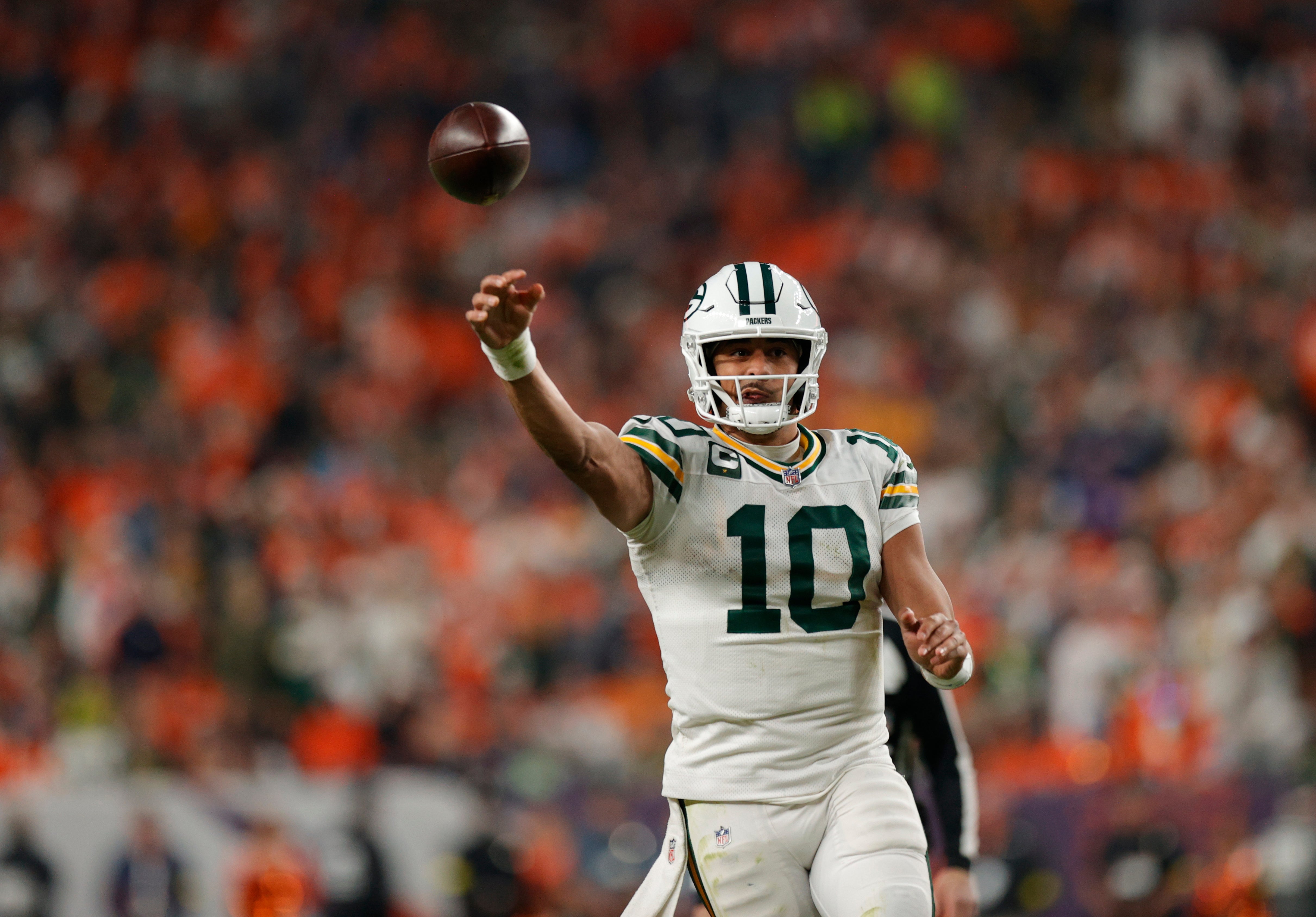 Dec 14, 2025; Denver, Colorado, USA; Green Bay Packers quarterback Jordan Love (10) throws downfield during the fourth quarter against the Denver Broncos at Empower Field at Mile High.