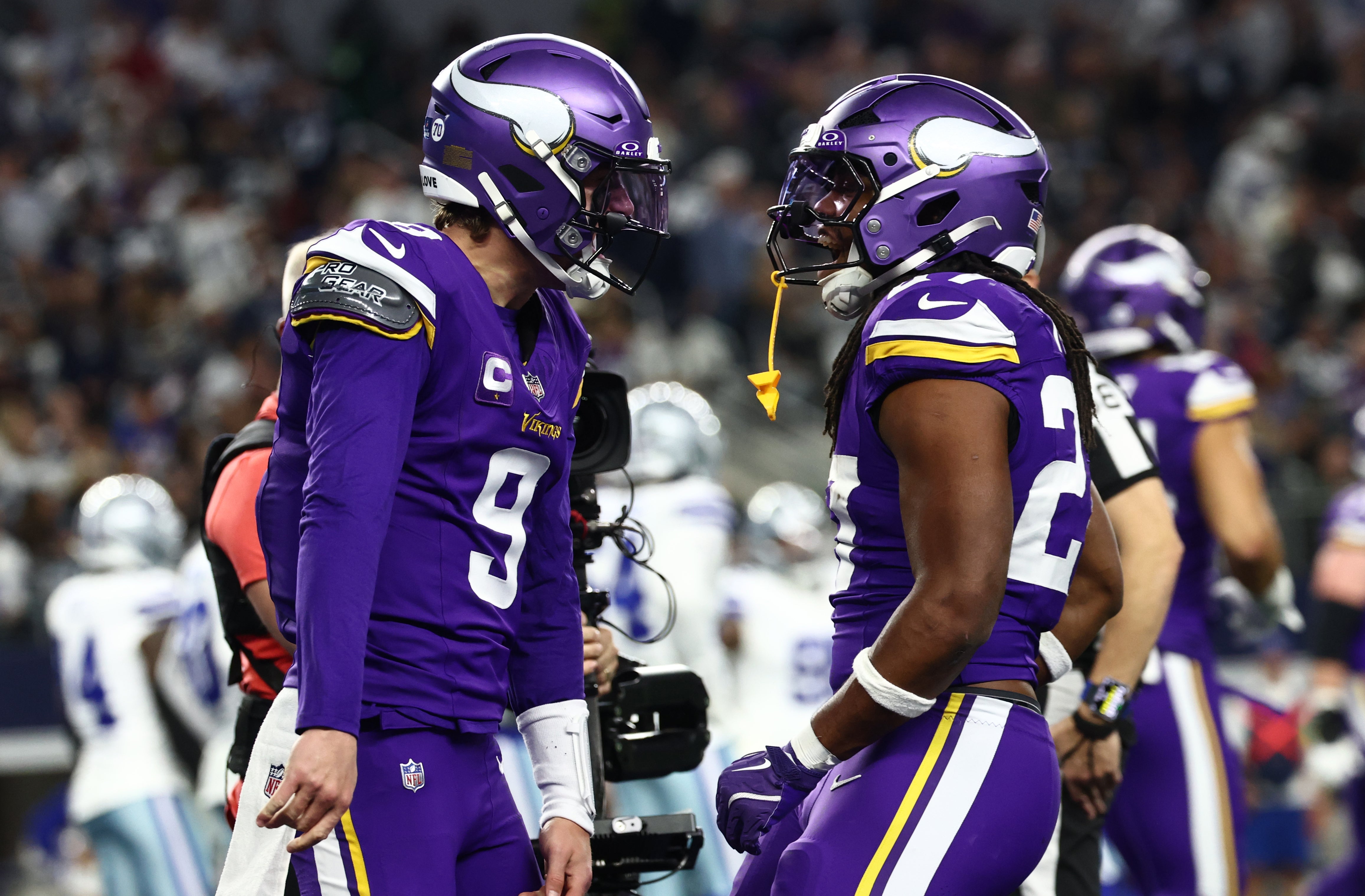 Dec 14, 2025; Arlington, Texas, USA; Minnesota Vikings quarterback J.J. McCarthy (9) celebrates with running back Jordan Mason (27) after a touchdown during the first half against the Dallas Cowboys at AT&T Stadium.