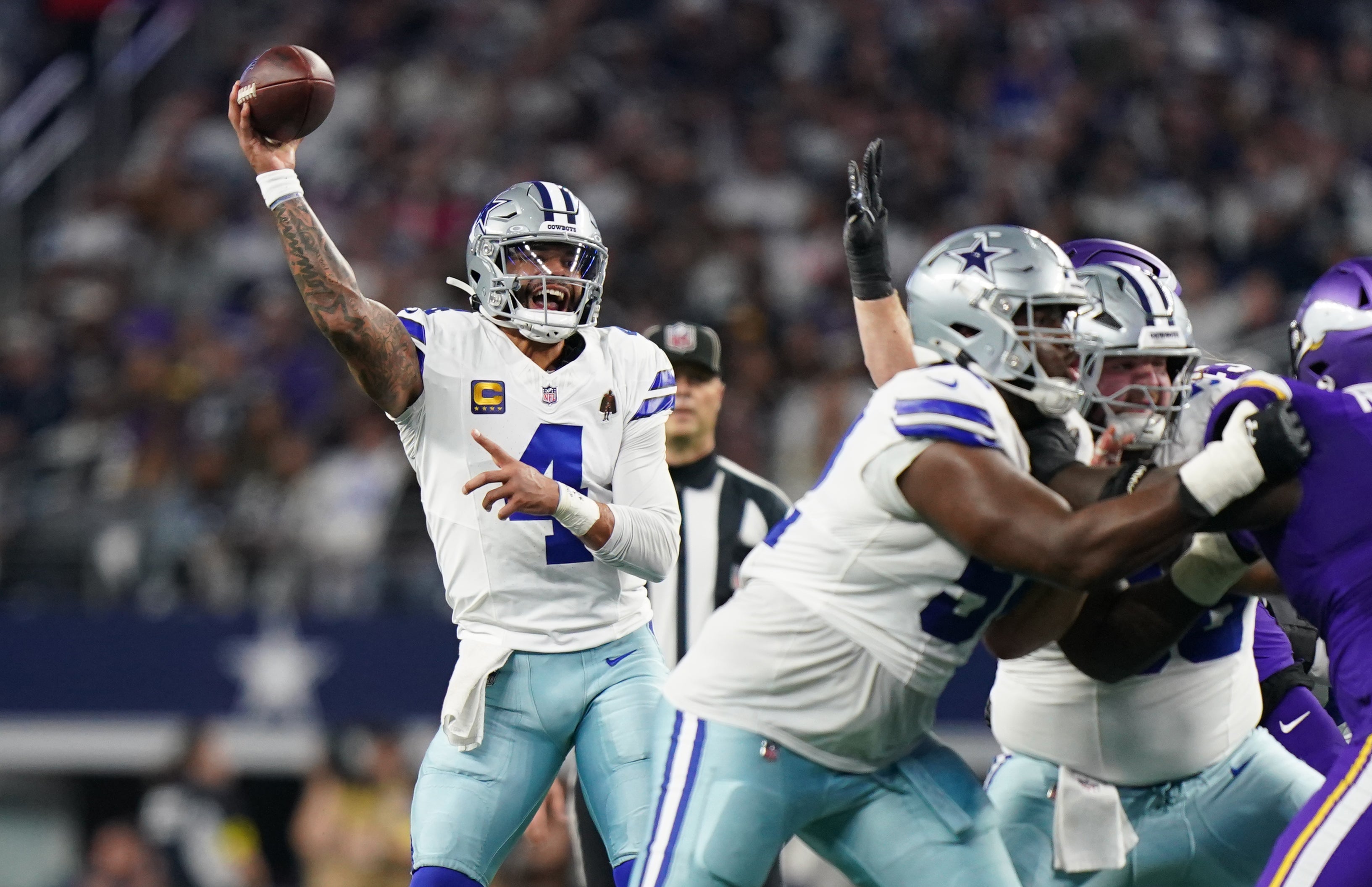 Dec 14, 2025; Arlington, Texas, USA; Dallas Cowboys quarterback Dak Prescott (4) throws during the second half against the Minnesota Vikings at AT&T Stadium.