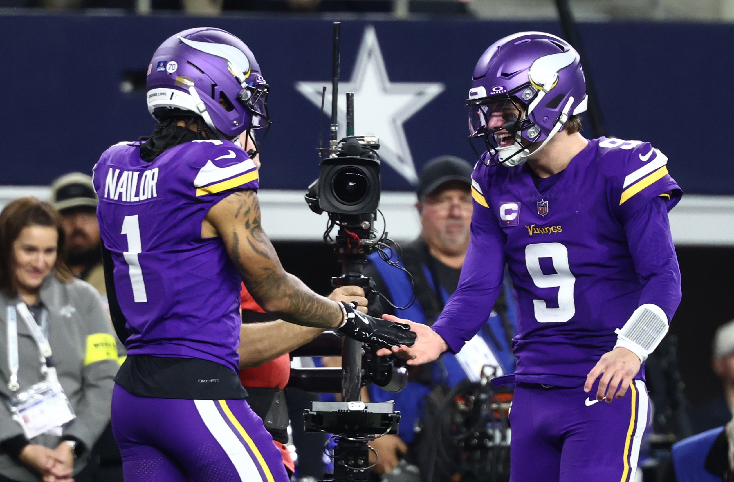 Dec 14, 2025; Arlington, Texas, USA; Minnesota Vikings wide receiver Jalen Nailor (1) celebrates with quarterback J.J. McCarthy (9) after a touchdown catch during the second half against the Dallas Cowboys at AT&T Stadium.