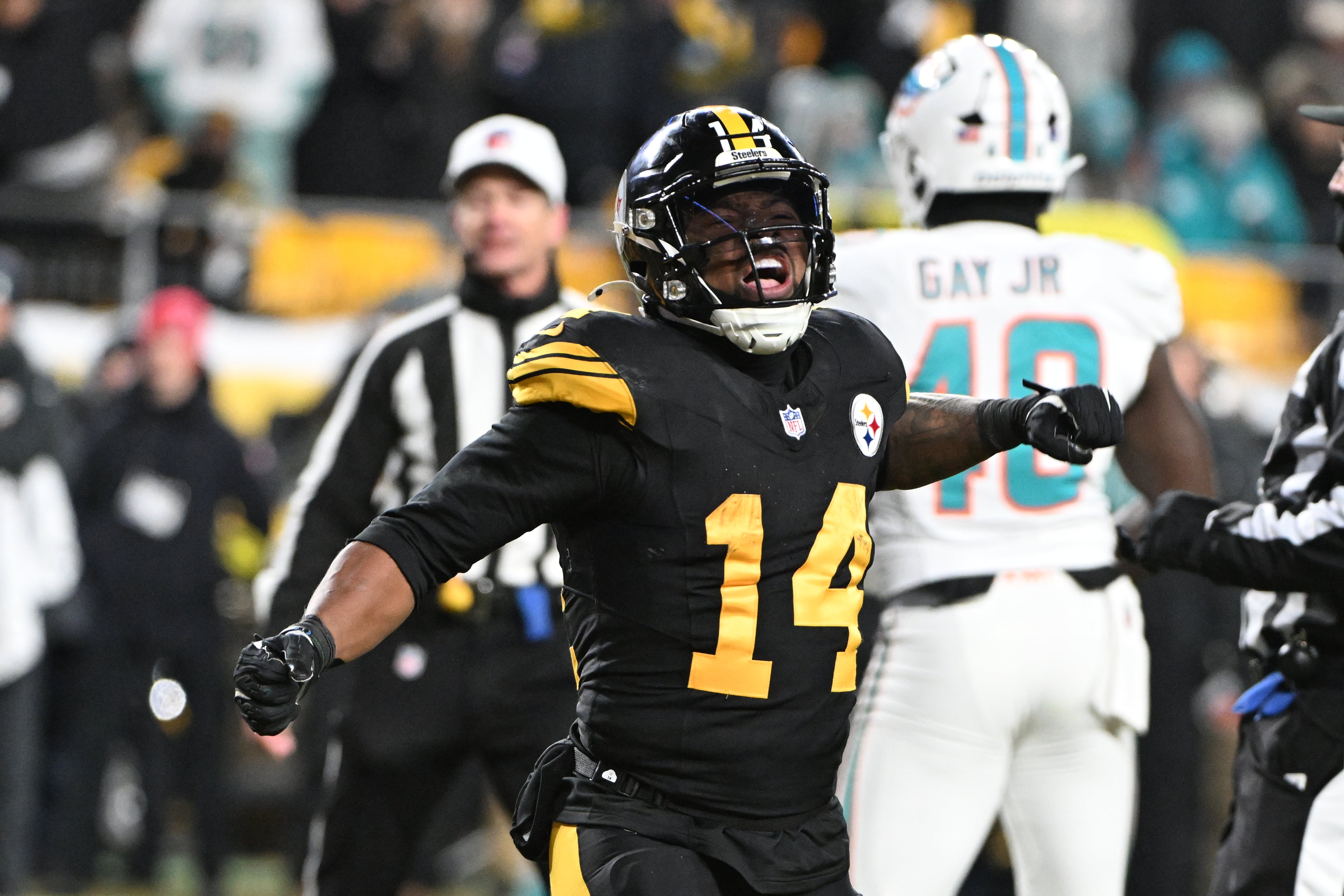Dec 15, 2025; Pittsburgh, Pennsylvania, USA; Pittsburgh Steelers running back Kenneth Gainwell (14) celebrates a touchdown scored by tight end Connor Heyward (83) in the second quarter against the Miami Dolphins at Acrisure Stadium.