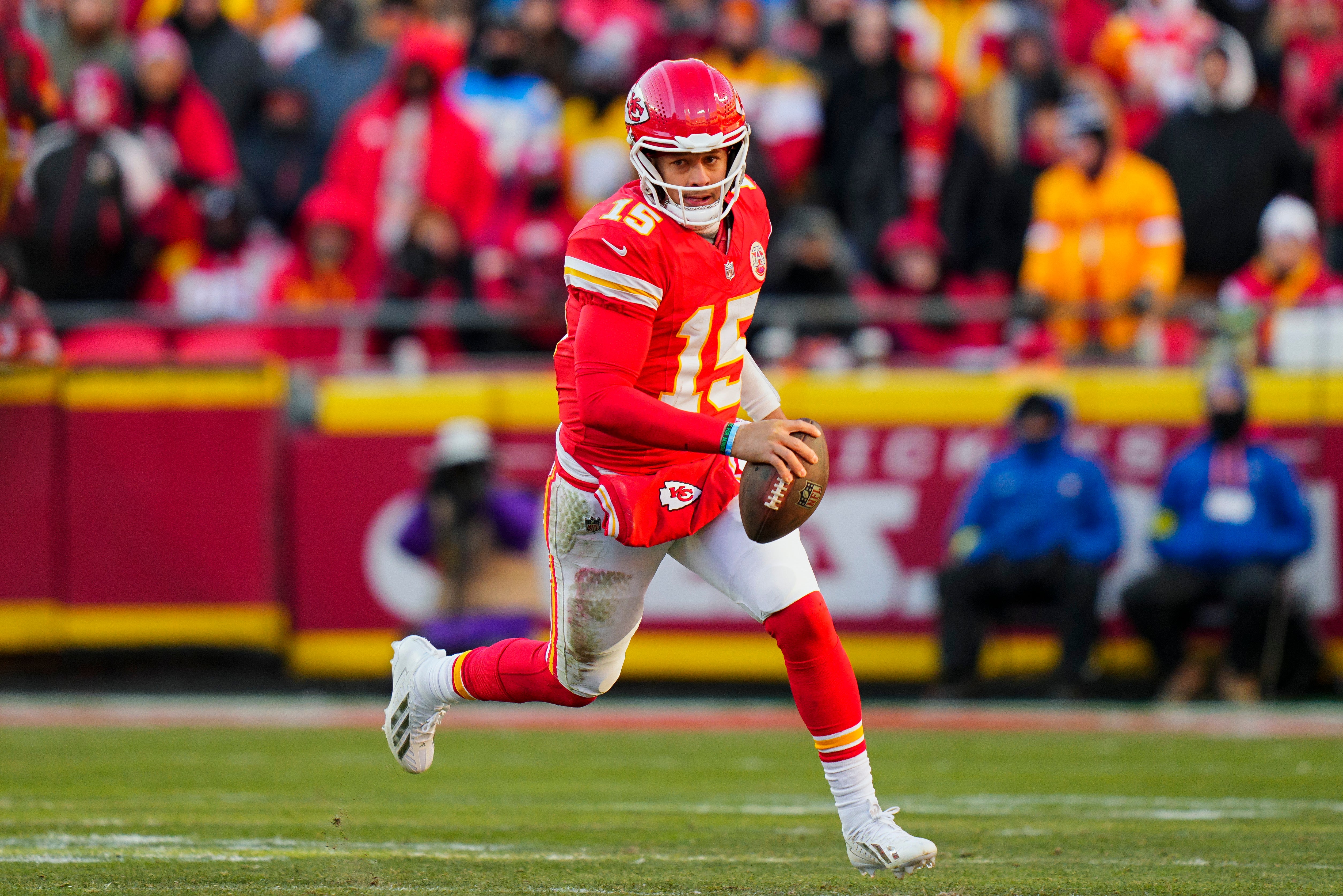 Dec 14, 2025; Kansas City, Missouri, USA; Kansas City Chiefs quarterback Patrick Mahomes (15) runs the ball during the second half against the Los Angeles Chargers at GEHA Field at Arrowhead Stadium.