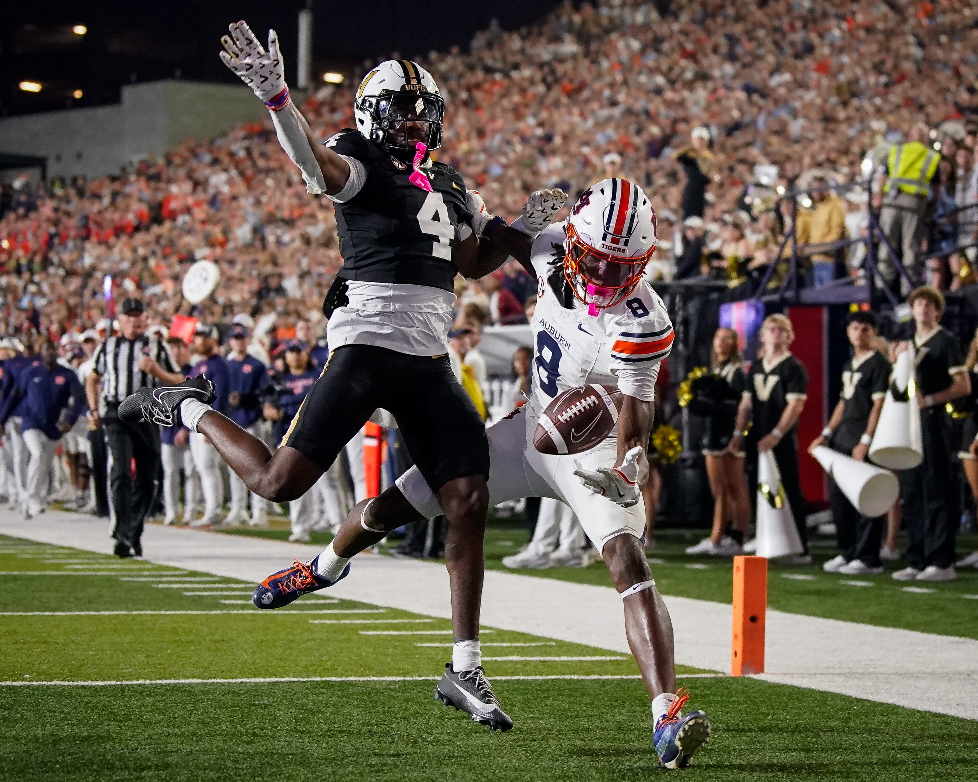 Auburn wide receiver Cam Coleman (8) receives a pass to pull in a touchdown past Vanderbilt cornerback Martel Hight (4) during the fourth quarter at FirstBank Stadium in Nashville, Tenn., Saturday, Nov. 8, 2025.