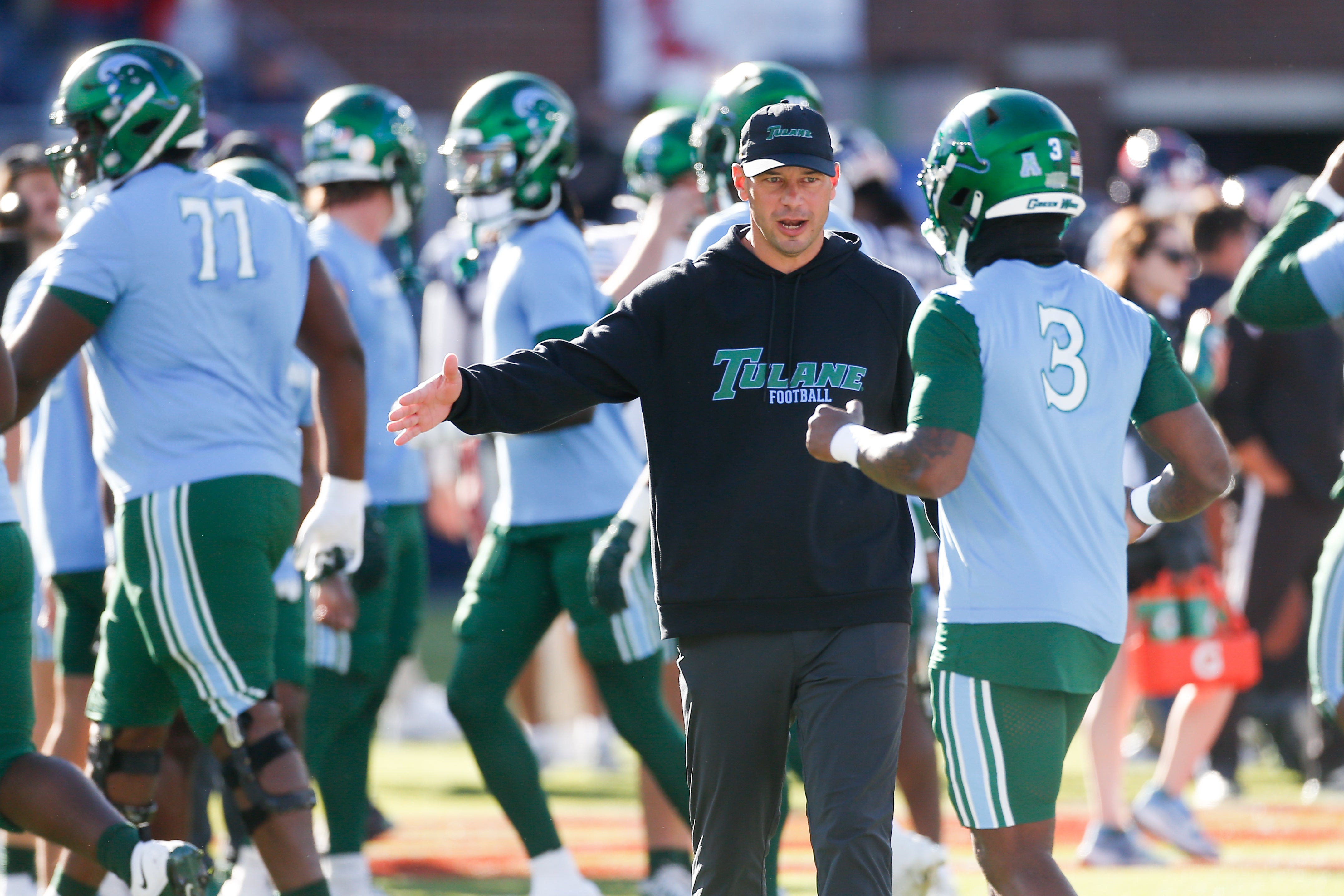 Dec 20, 2025; Oxford, MS, USA; Tulane Green Wave head coach Jon Sumrall on the field prior to a game Mississippi Rebels at Vaught-Hemingway Stadium.