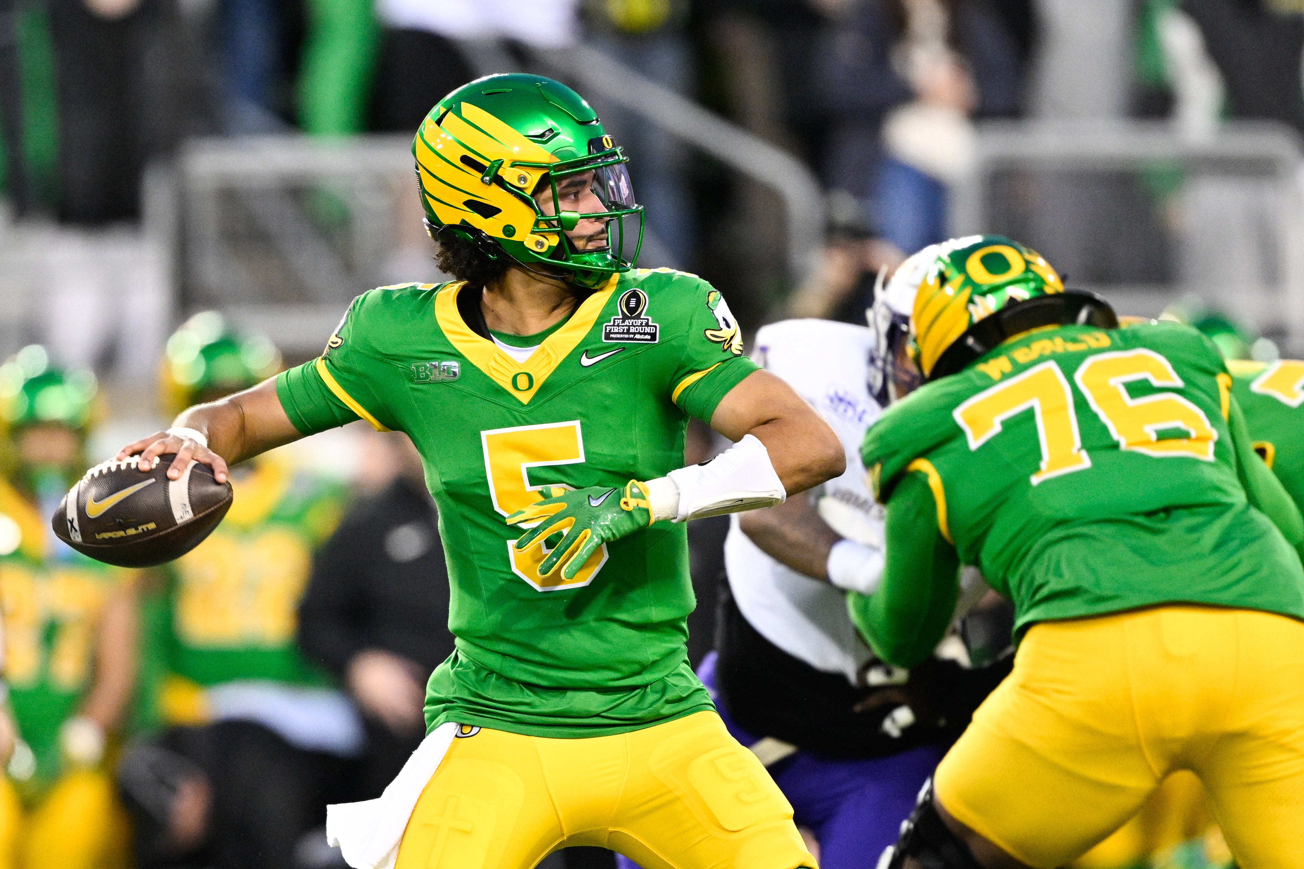 Dec 20, 2025; Eugene, OR, USA; Oregon Ducks quarterback Dante Moore (5) throws a pass during the first quarter against the James Madison Dukes at Autzen Stadium.
