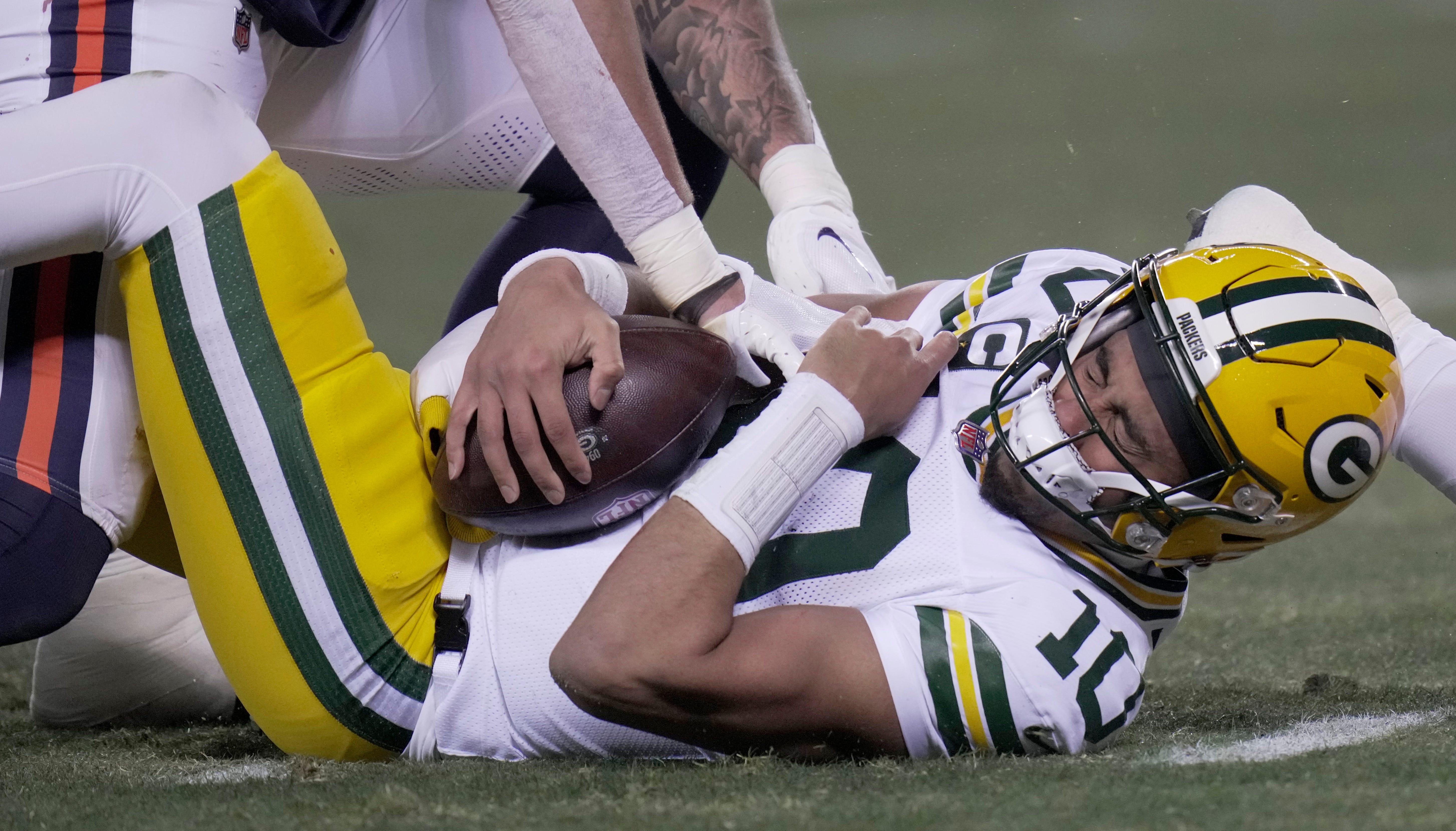 Green Bay Packers quarterback Jordan Love (10) is injured after being sacked during the second quarter of their game Saturday, December 20, 2025 at Soldier Field in Chicago, Illinois. Love left the game and the Chicago Bears were penalized for the hit.