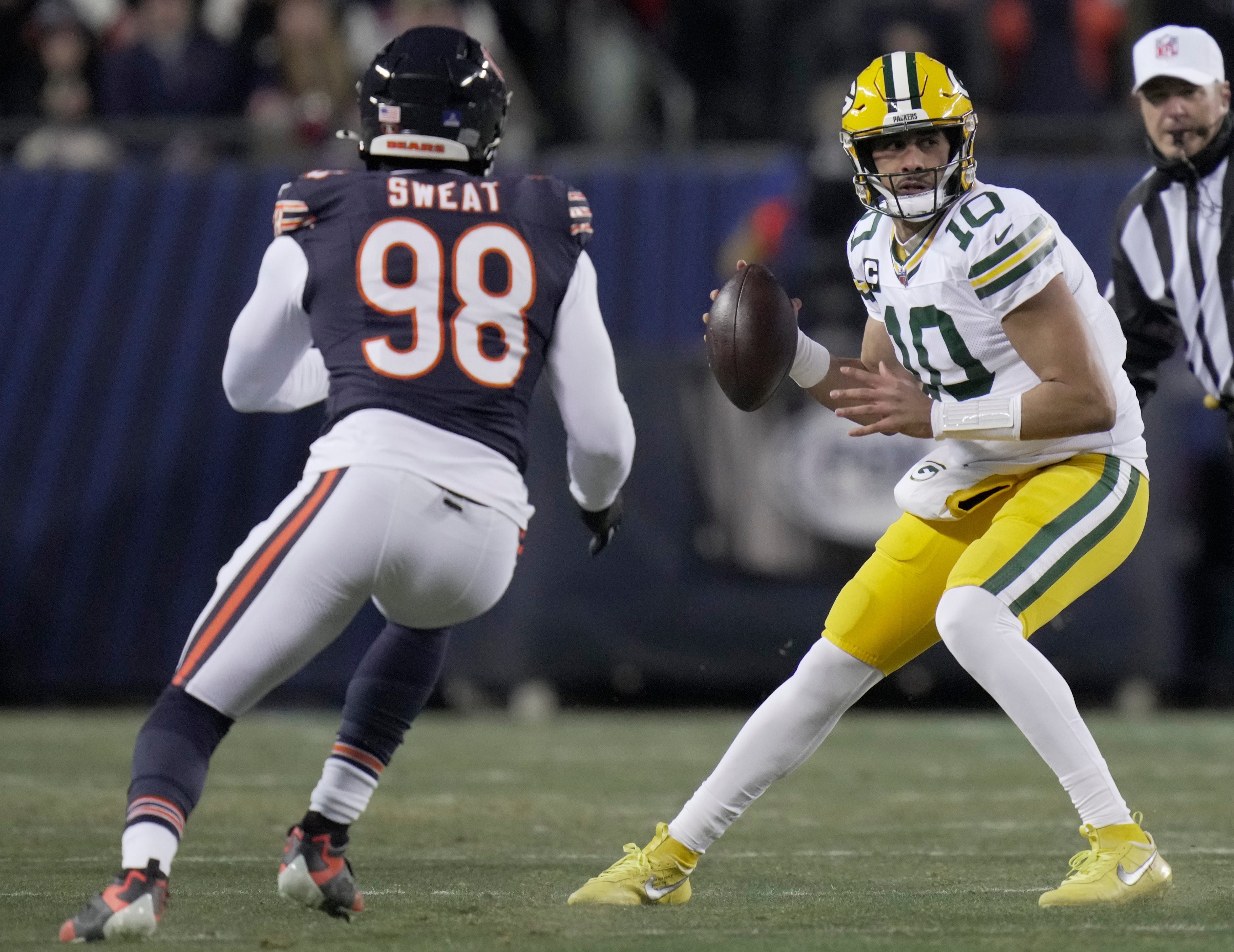 Green Bay Packers quarterback Jordan Love (10) is pressured by Chicago Bears defensive end Montez Sweat (98) during the first quarter of their game Saturday, December 20, 2025 at Soldier Field in Chicago, Illinois.