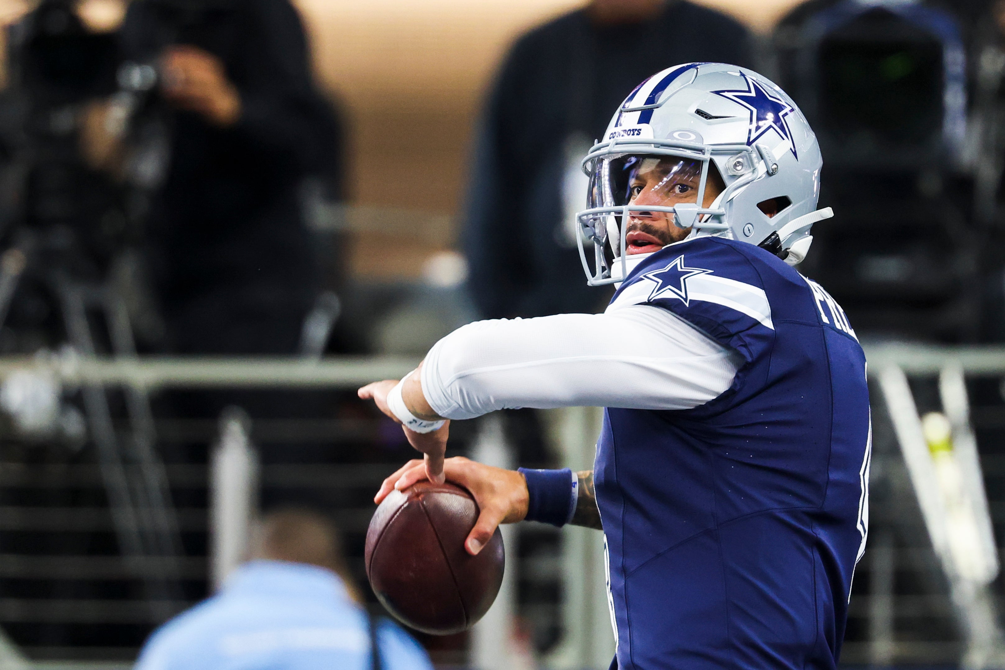 Dec 21, 2025; Arlington, Texas, USA; Dallas Cowboys quarterback Dak Prescott (4) participates in pregame warmups against the Los Angeles Chargers at AT&T Stadium.