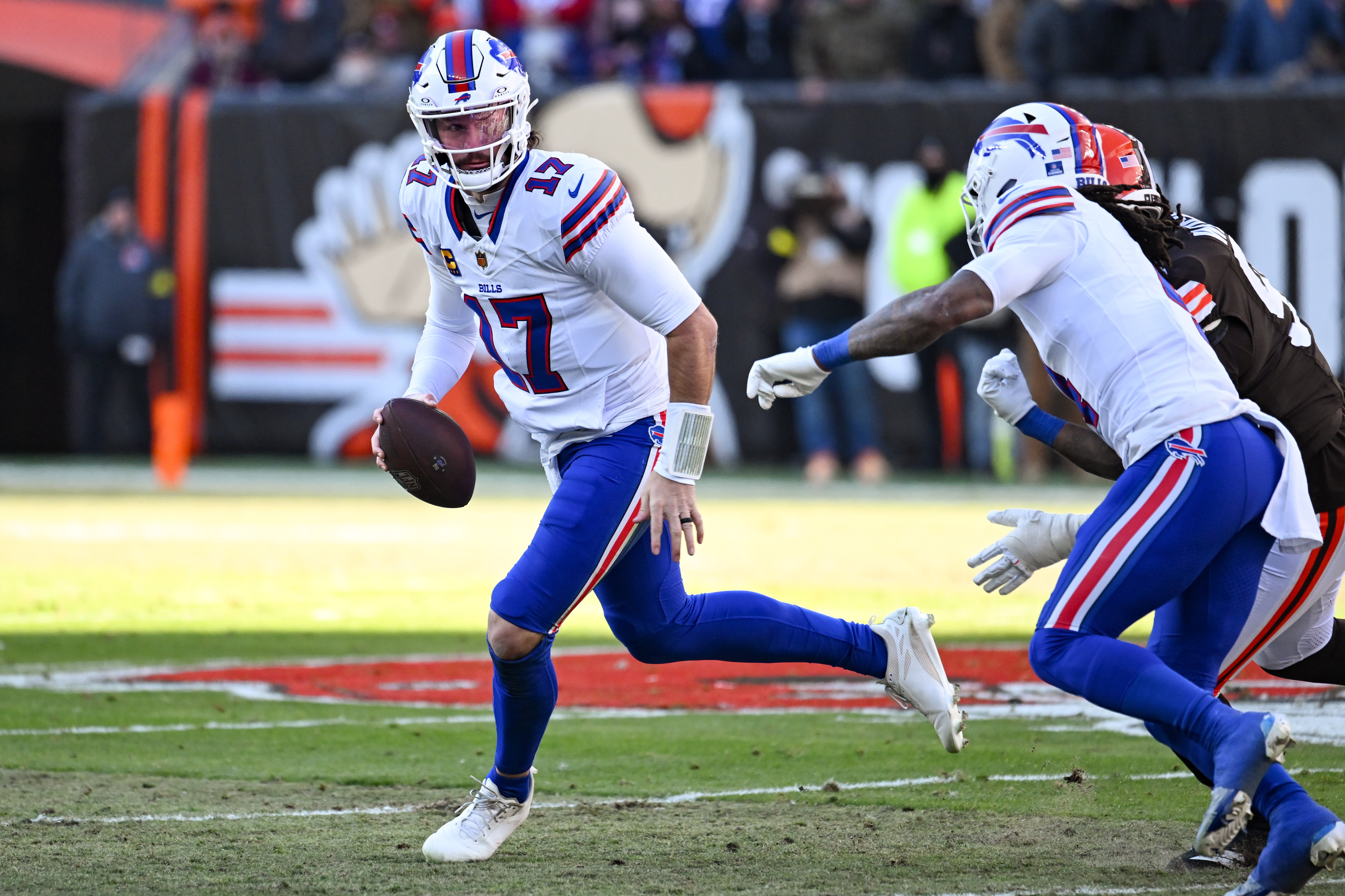 Dec 21, 2025; Cleveland, Ohio, USA; Buffalo Bills quarterback Josh Allen (17) rolls out against the Cleveland Browns during the first half at Huntington Bank Field.