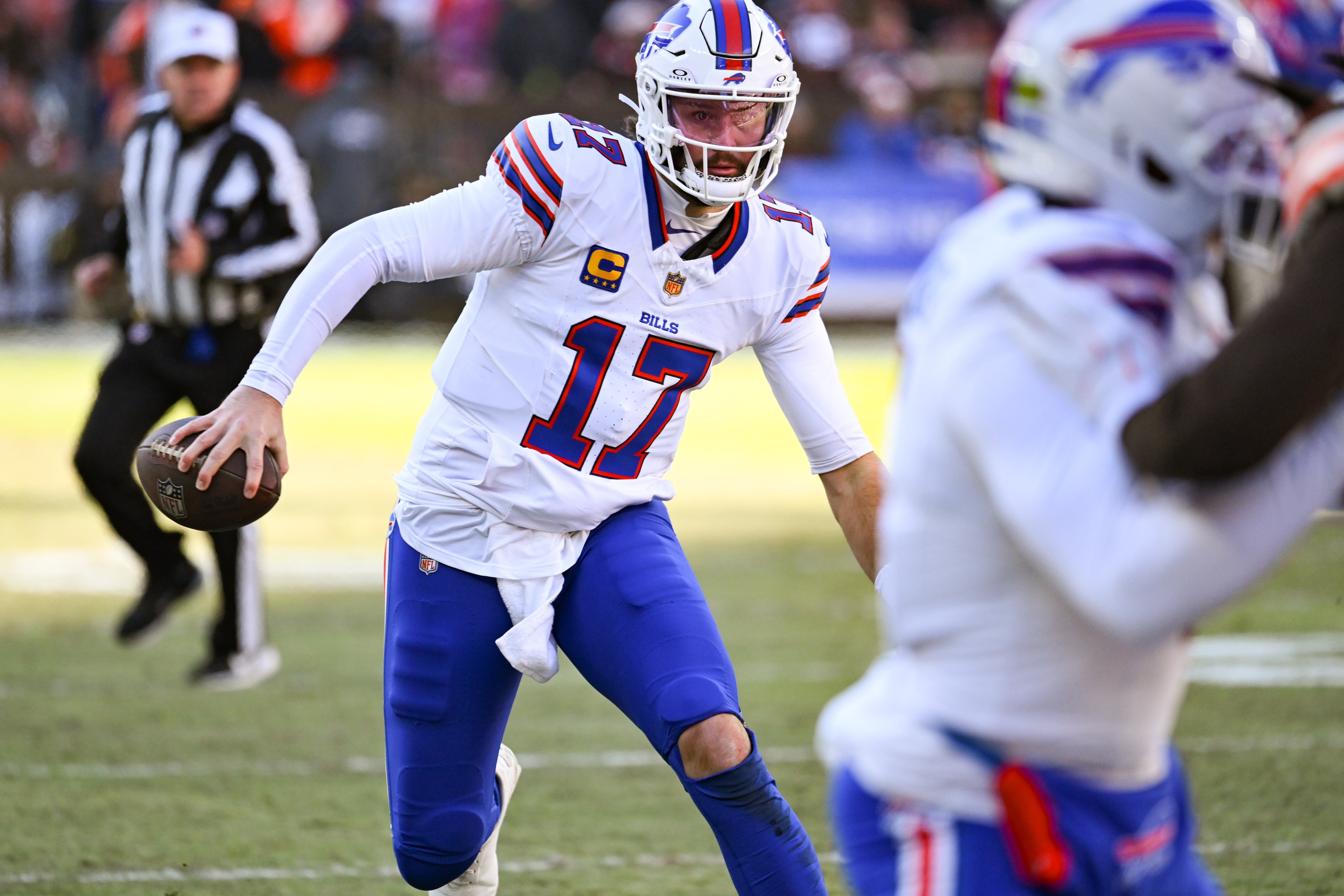Dec 21, 2025; Cleveland, Ohio, USA; Buffalo Bills quarterback Josh Allen (17) runs with the ball against the Cleveland Browns during the first half at Huntington Bank Field.