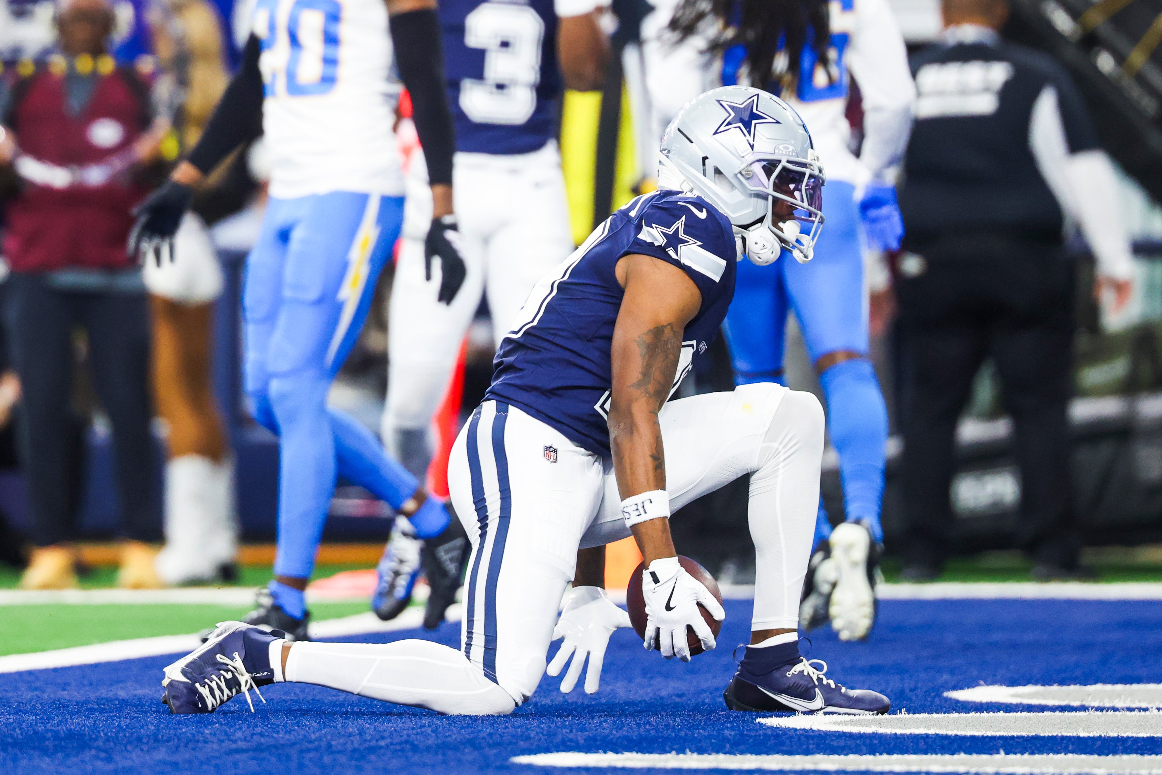 Dec 21, 2025; Arlington, Texas, USA; Dallas Cowboys wide receiver Ryan Flournoy (19) celebrates after catching a touchdown pass against the Los Angeles Chargers during the first quarter at AT&T Stadium.