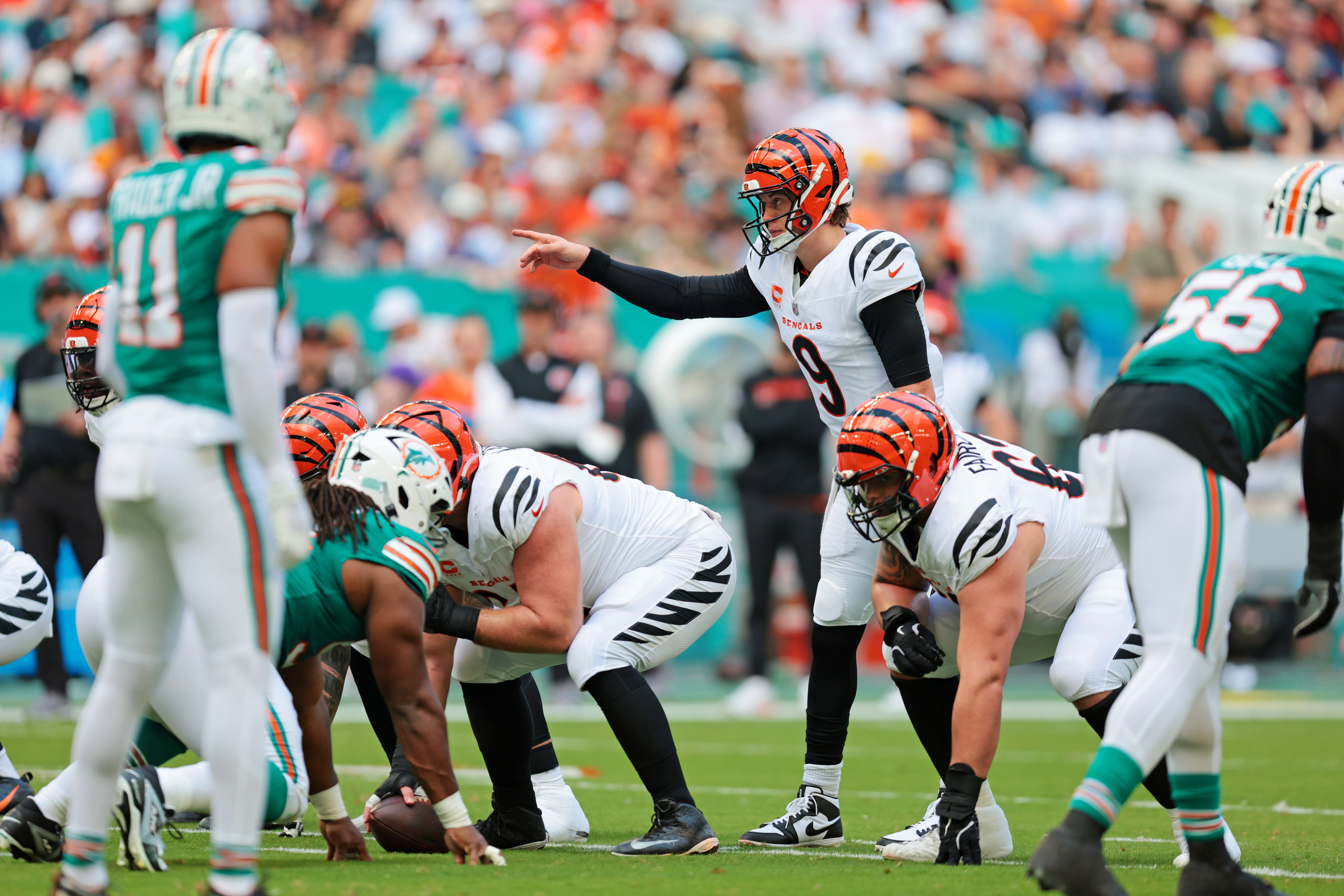 Dec 21, 2025; Miami Gardens, Florida, USA; Cincinnati Bengals quarterback Joe Burrow (9) reacts during a play during the first quarter against the Miami Dolphins at Hard Rock Stadium.