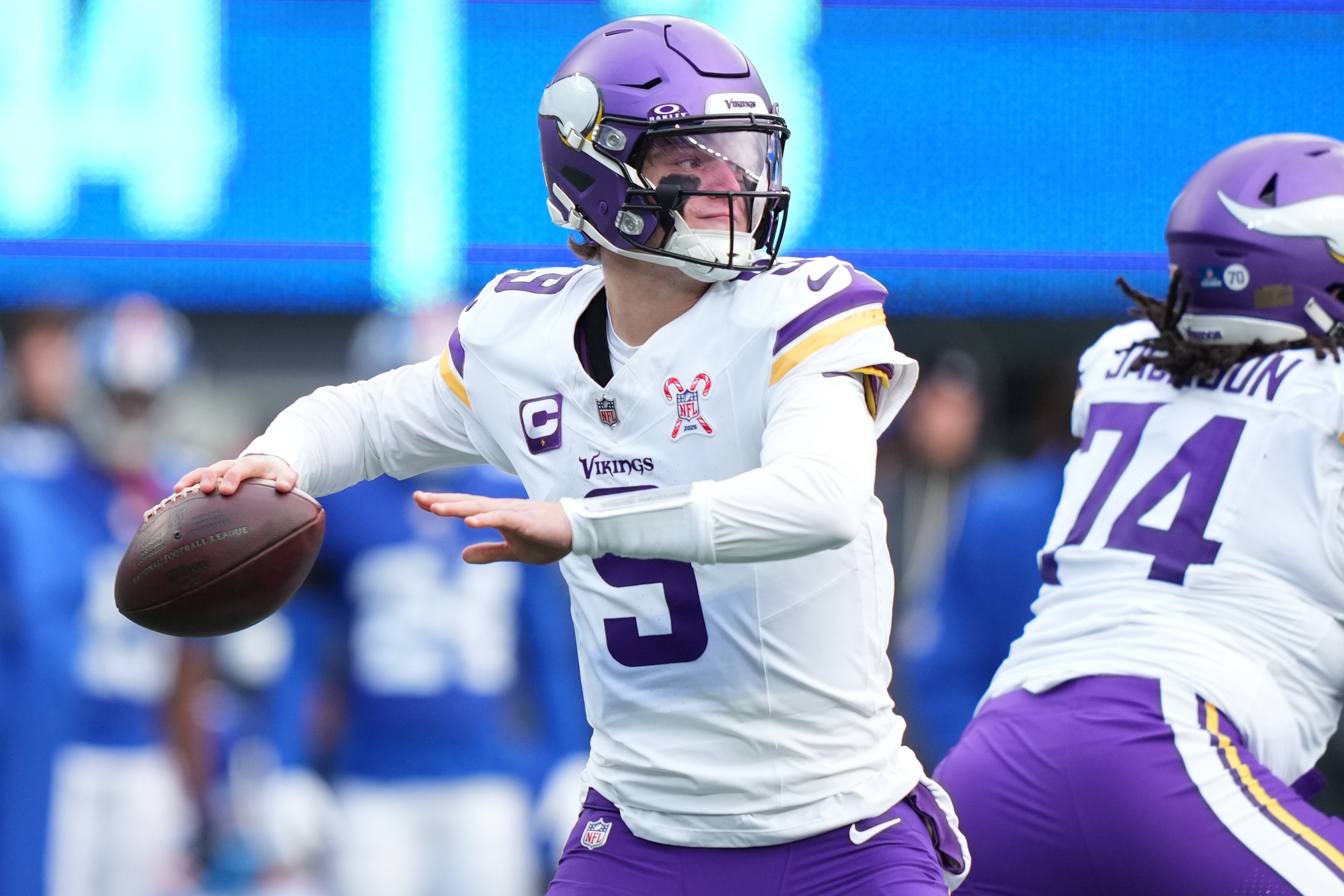 Dec 21, 2025; East Rutherford, New Jersey, USA; Minnesota Vikings quarterback J.J. McCarthy (9) drops back to pass against the New York Giants during the first half at MetLife Stadium.