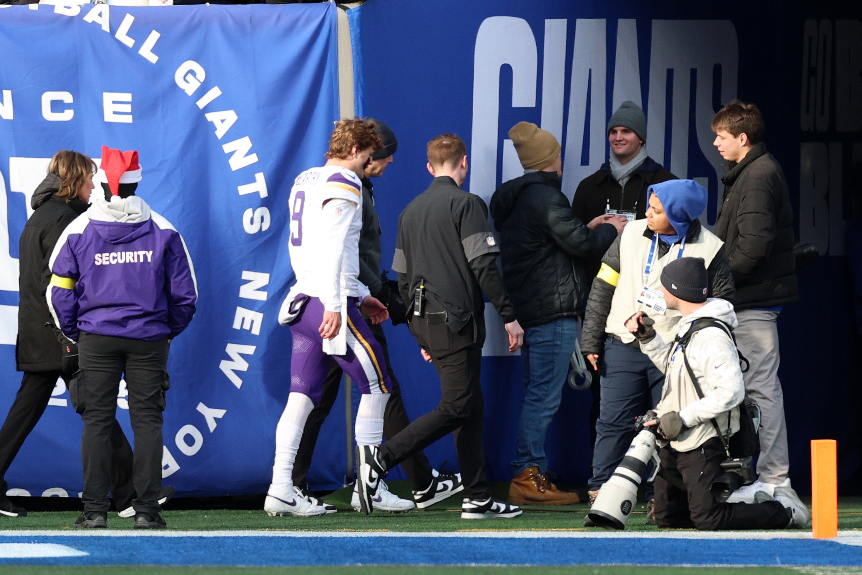 Dec 21, 2025; East Rutherford, New Jersey, USA; Minnesota Vikings quarterback J.J. McCarthy (9) is taken to the locker room after a hit against the New York Giants during the first half at MetLife Stadium.