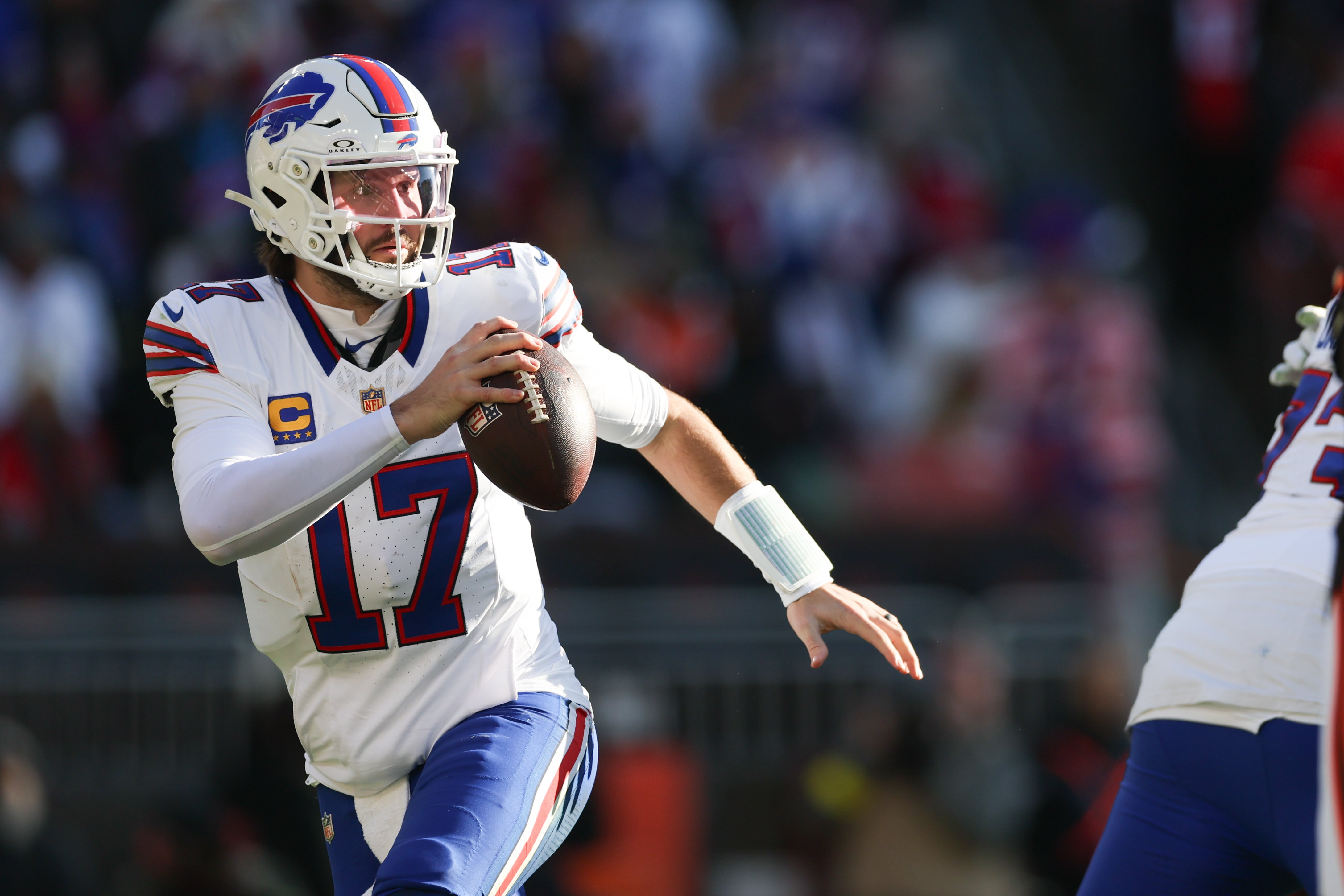 Dec 21, 2025; Cleveland, Ohio, USA; Buffalo Bills quarterback Josh Allen (17) looks downfield against the Cleveland Browns during the first half at Huntington Bank Field.