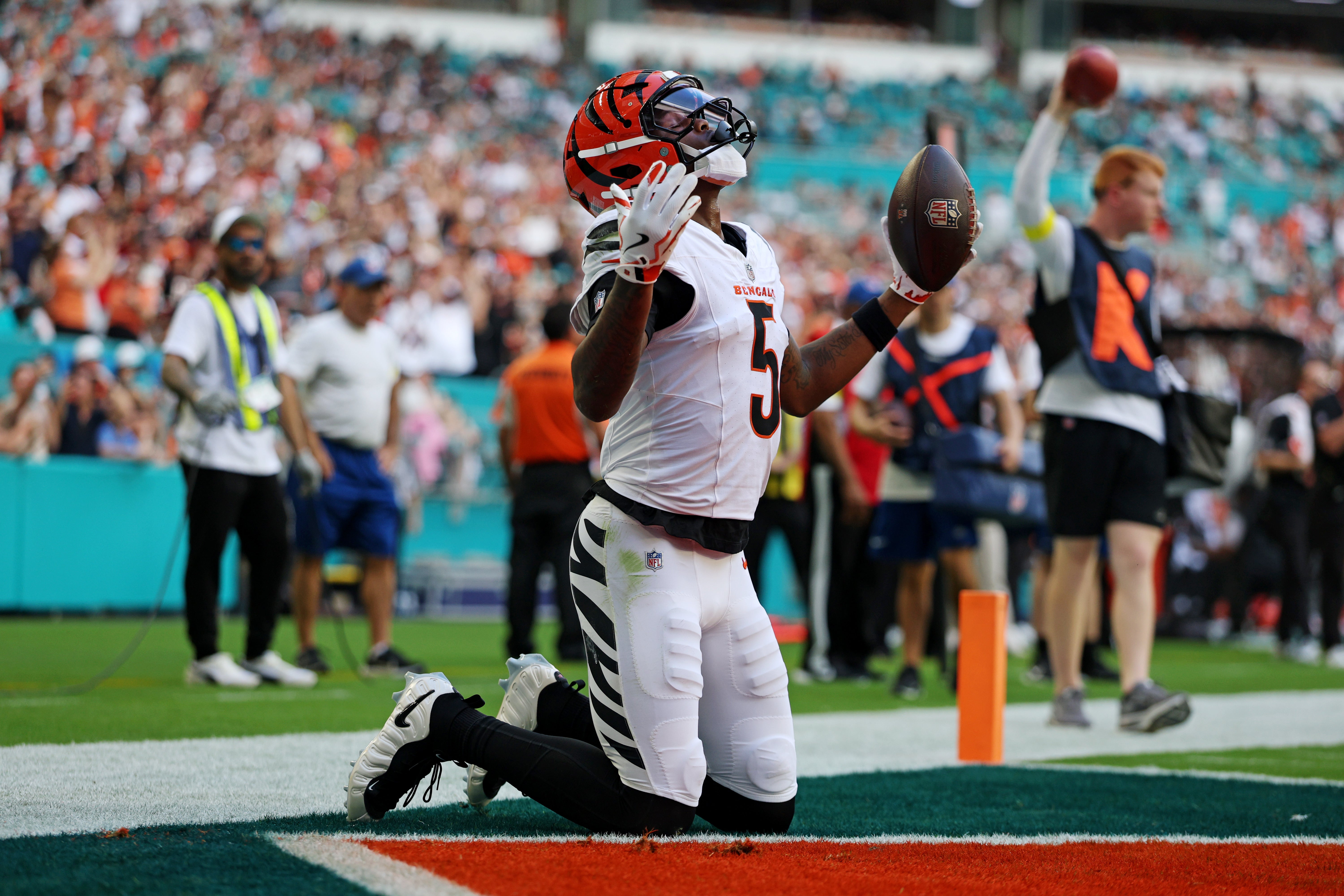 Dec 21, 2025; Miami Gardens, Florida, USA; Cincinnati Bengals wide receiver Tee Higgins (5) scores a touchdown during the second quarter against the Miami Dolphins at Hard Rock Stadium.