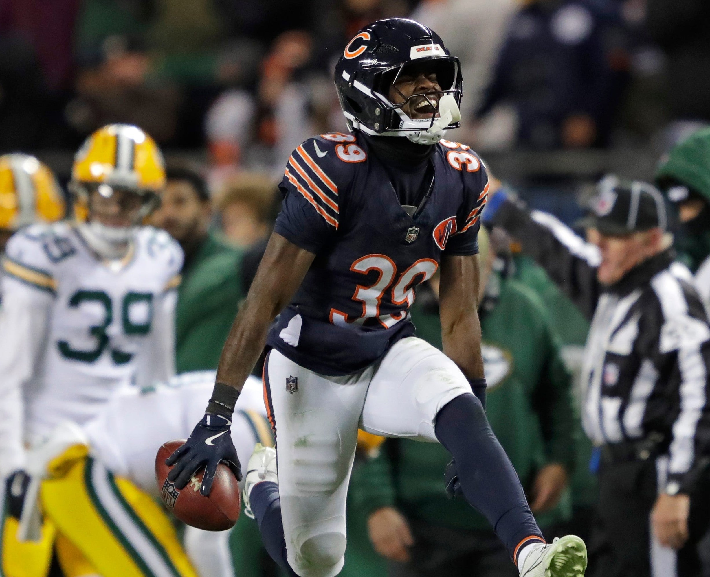 Chicago Bears cornerback Josh Blackwell (39) celebrates recovering an onside kick mishandled by Green Bay Packers wide receiver Romeo Doubs (87) in the fourth quarter during their football game Saturday, December 20, 2025, at Soldier Field in Chicago, Illinois.