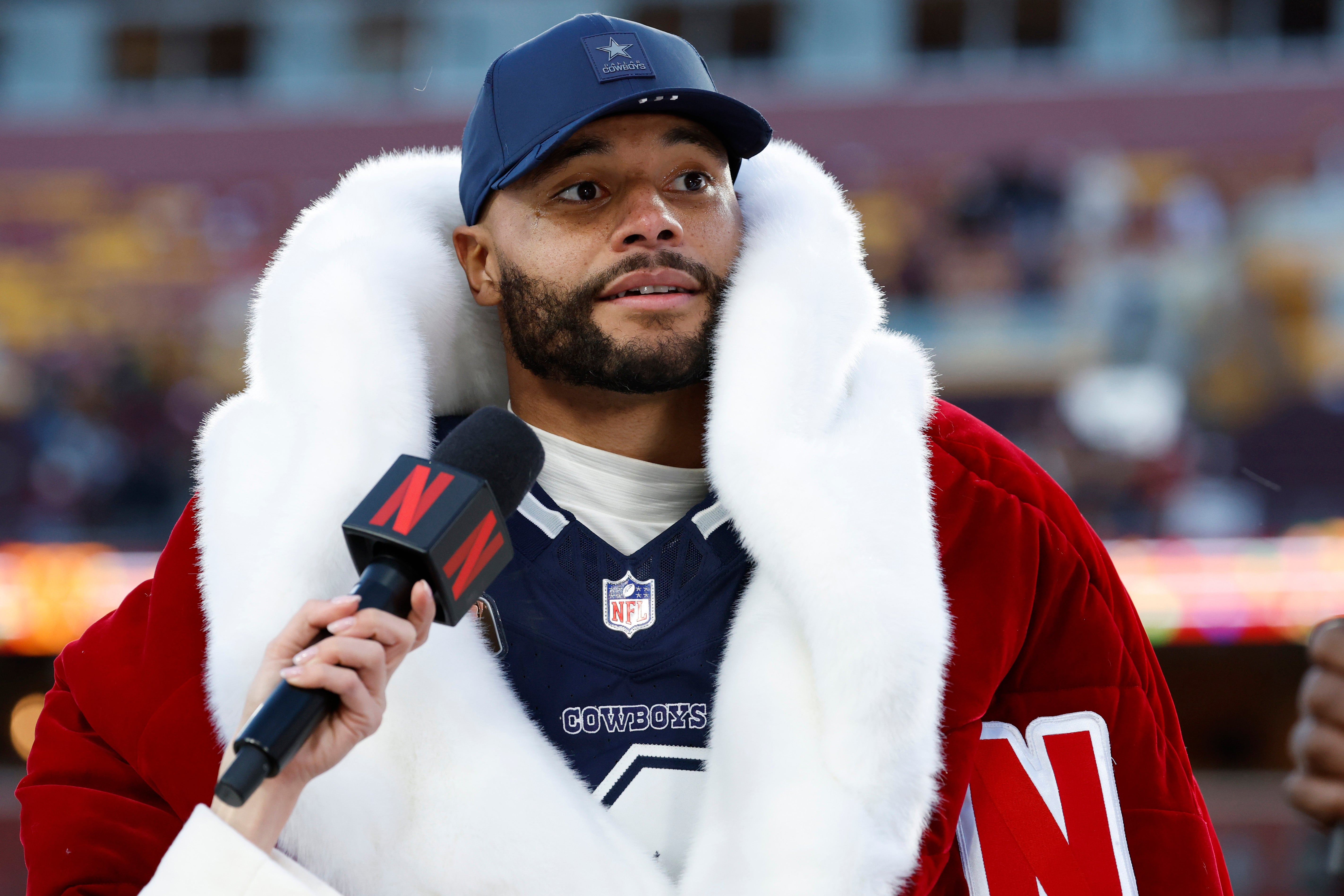 Dec 25, 2025; Landover, Maryland, USA; Dallas Cowboys quarterback Dak Prescott (4) is interviewed after defeating the Washington Commanders at Northwest Stadium.