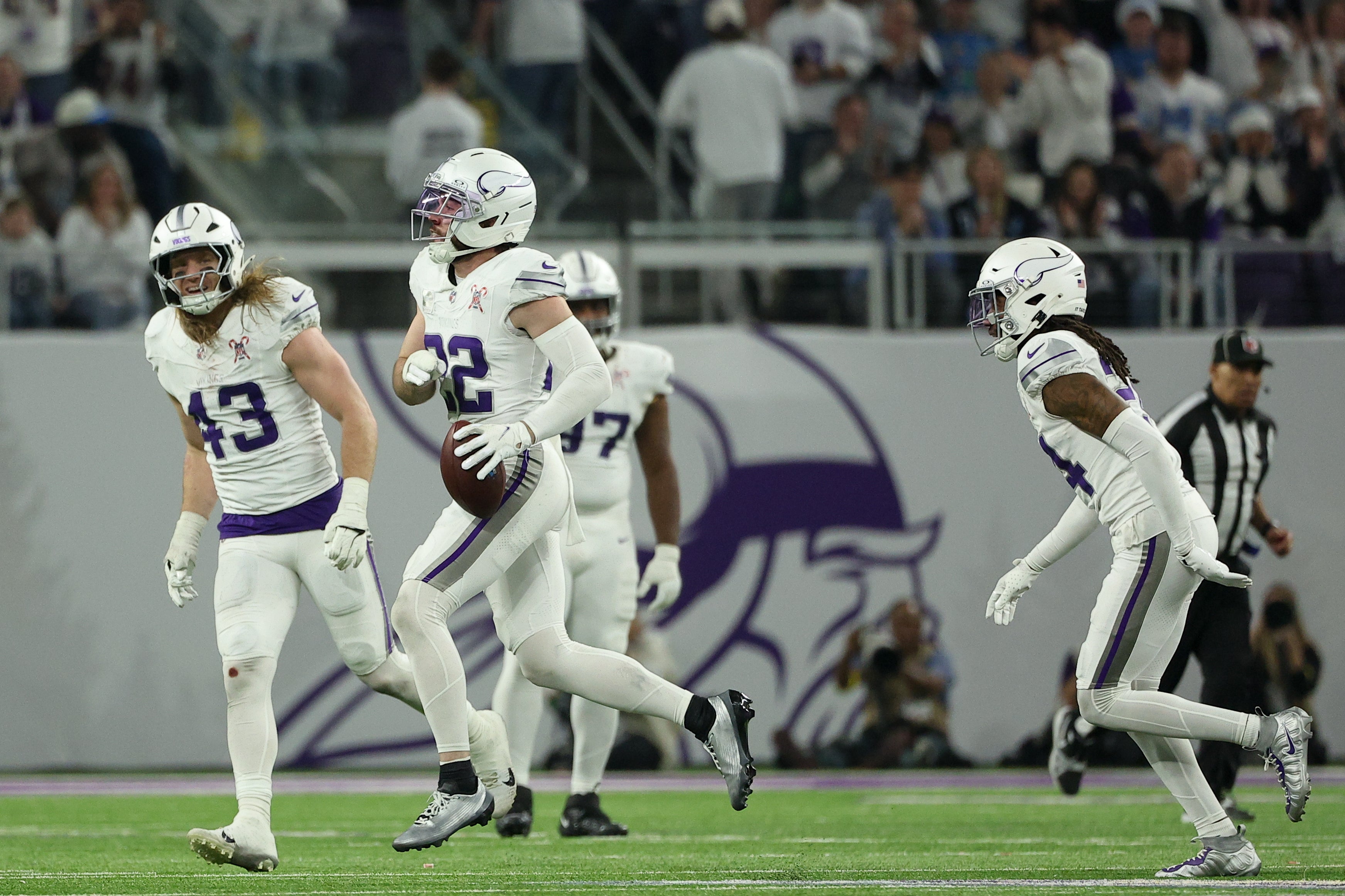 Dec 25, 2025; Minneapolis, Minnesota, USA; Minnesota Vikings safety Harrison Smith (22) celebrates after catching an interception against the Detroit Lions in the third quarter at U.S. Bank Stadium.